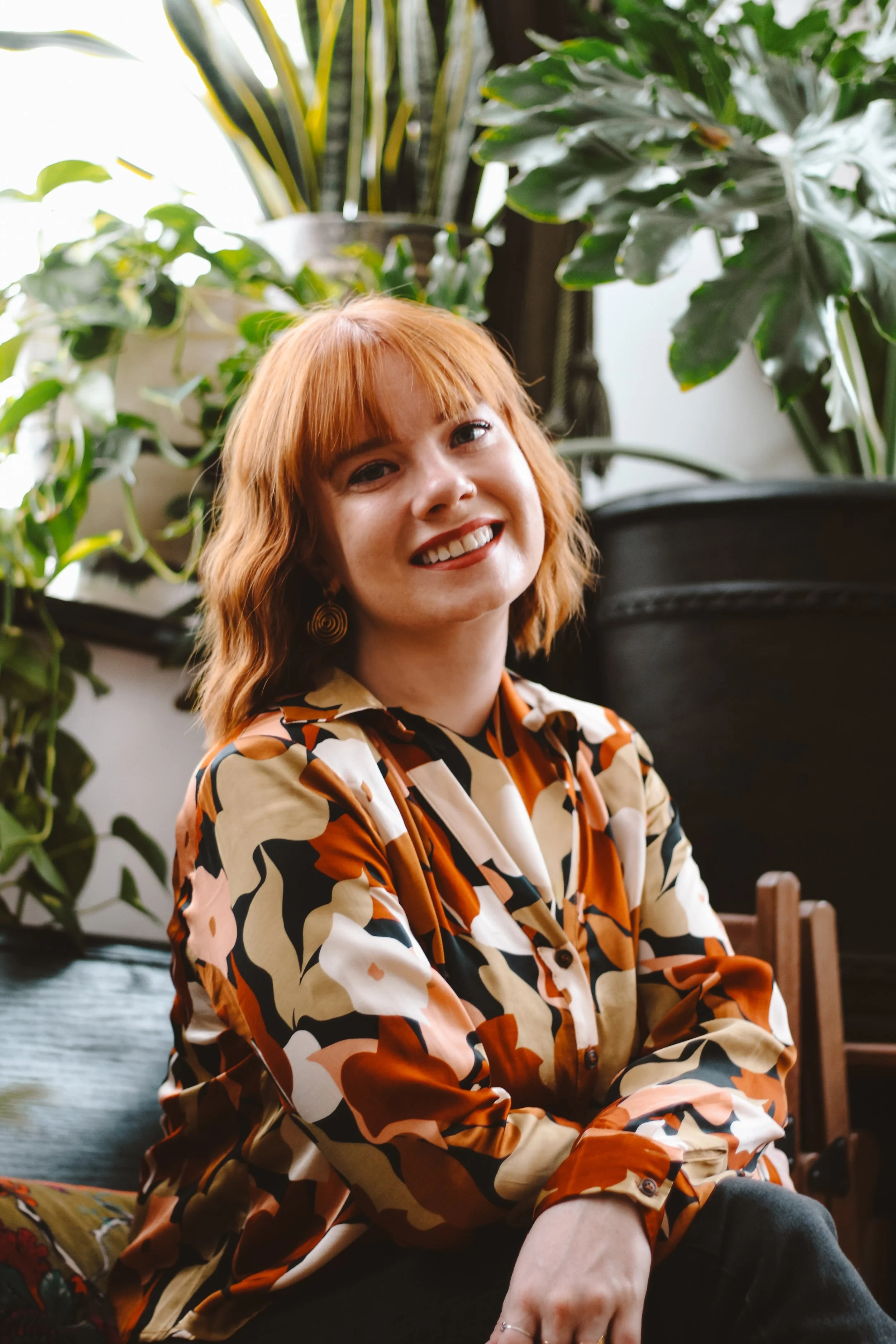Katarina “Kat” Bennicoff Yundt, a Brooklyn somatic and trauma-informed therapist, smiling in a professional headshot.