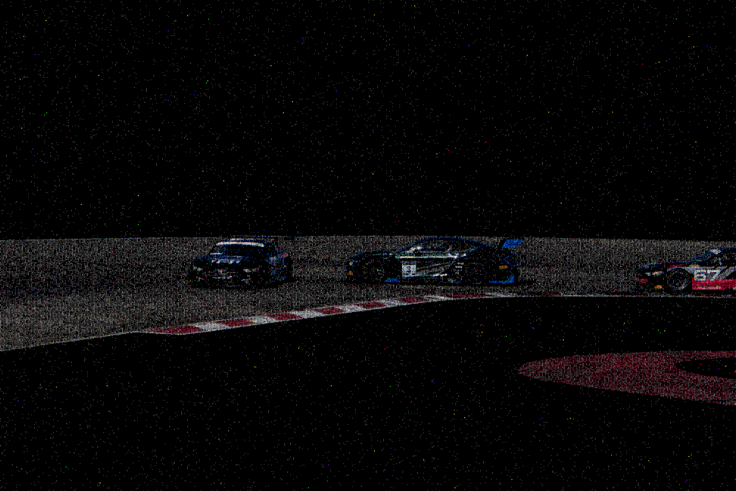 A race car in motion on a racing track at night, with a star-filled sky above.