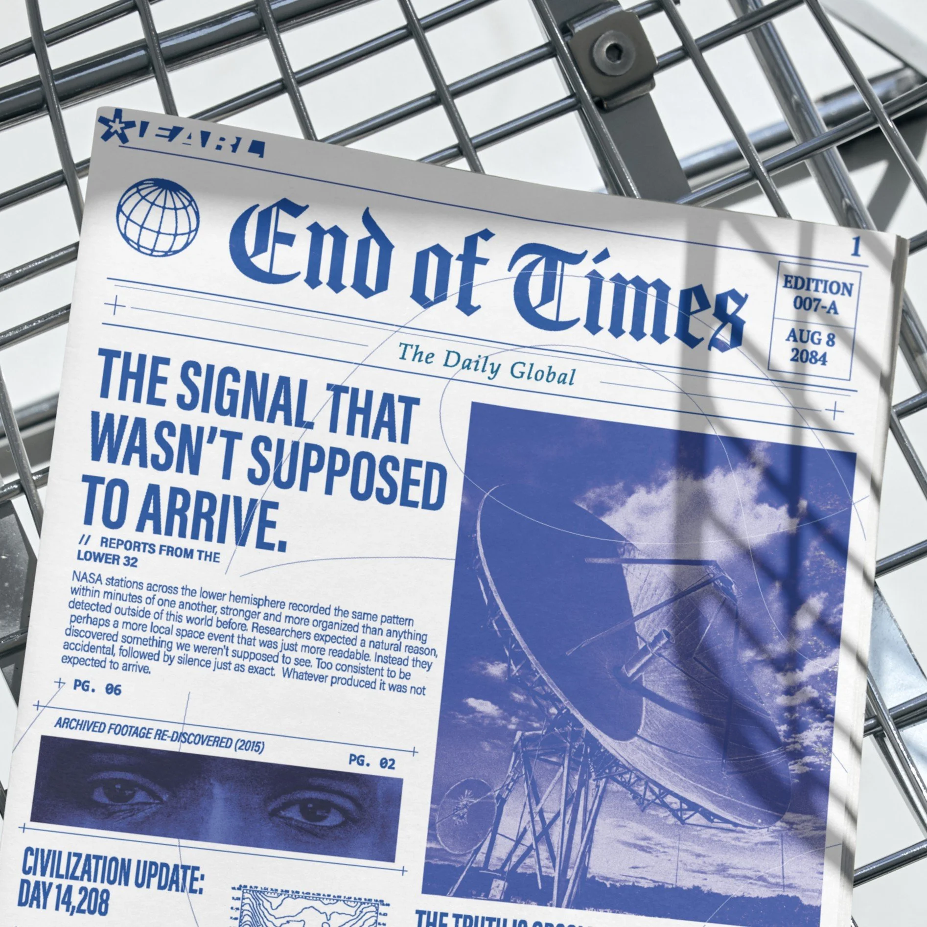 Front page of a newspaper titled "End of Times" with a globe icon, some text, and images of a sky with clouds and an eye, placed on a metal shopping cart.