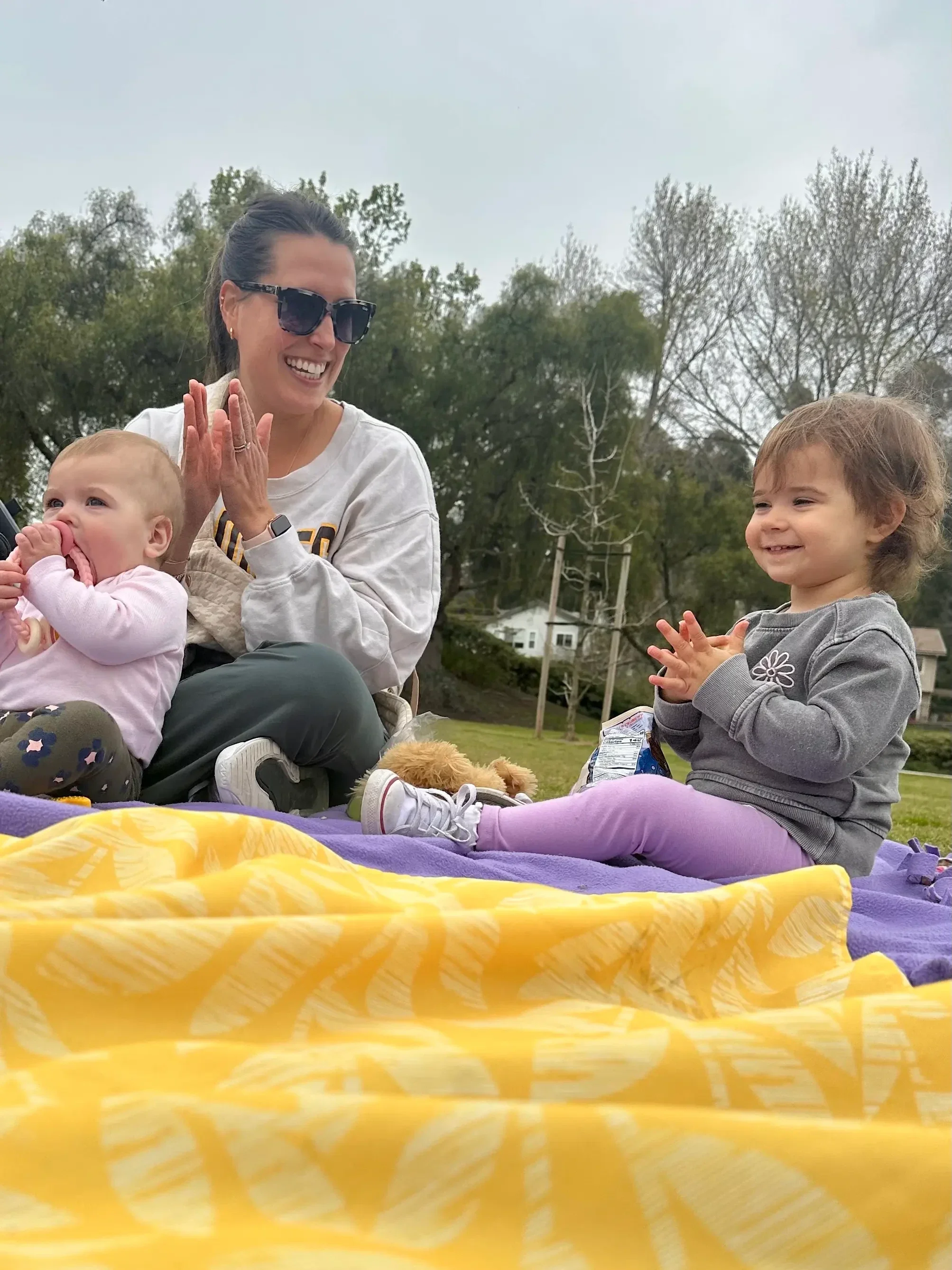 parent-and-toddlers-clapping-game-encinitas-park.webp