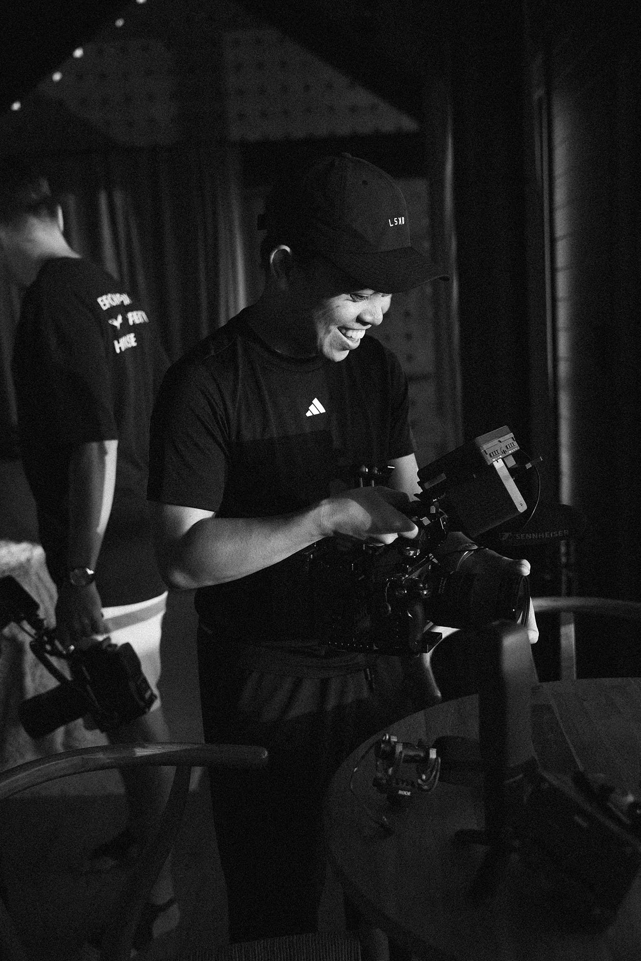 A candid behind-the-scenes moment as the Brown Fox crew prepares the cinema camera for the next LSKD spec film setup.