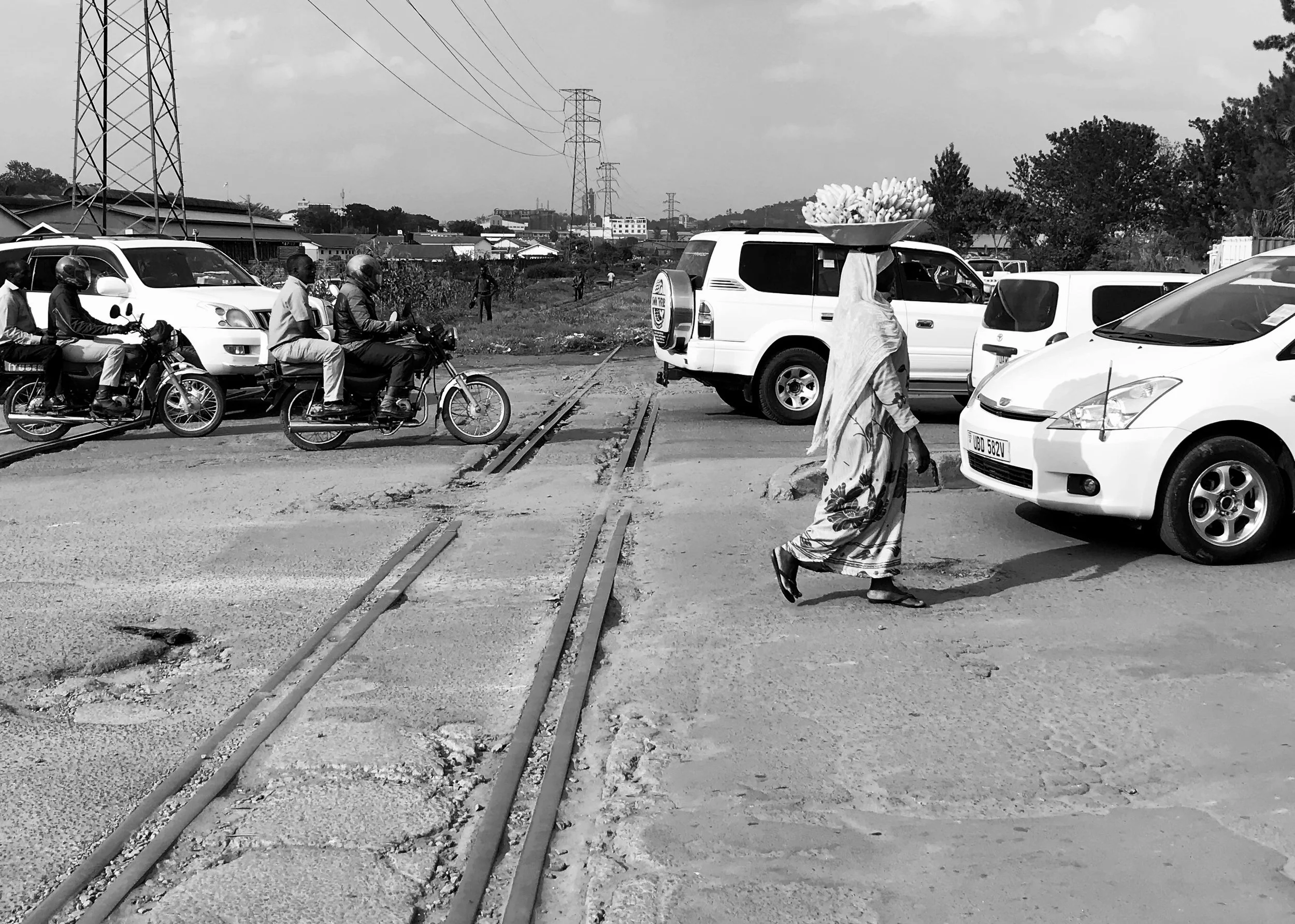 Cars and pedestrians crossing the Railway Line, Kampala, Uganda