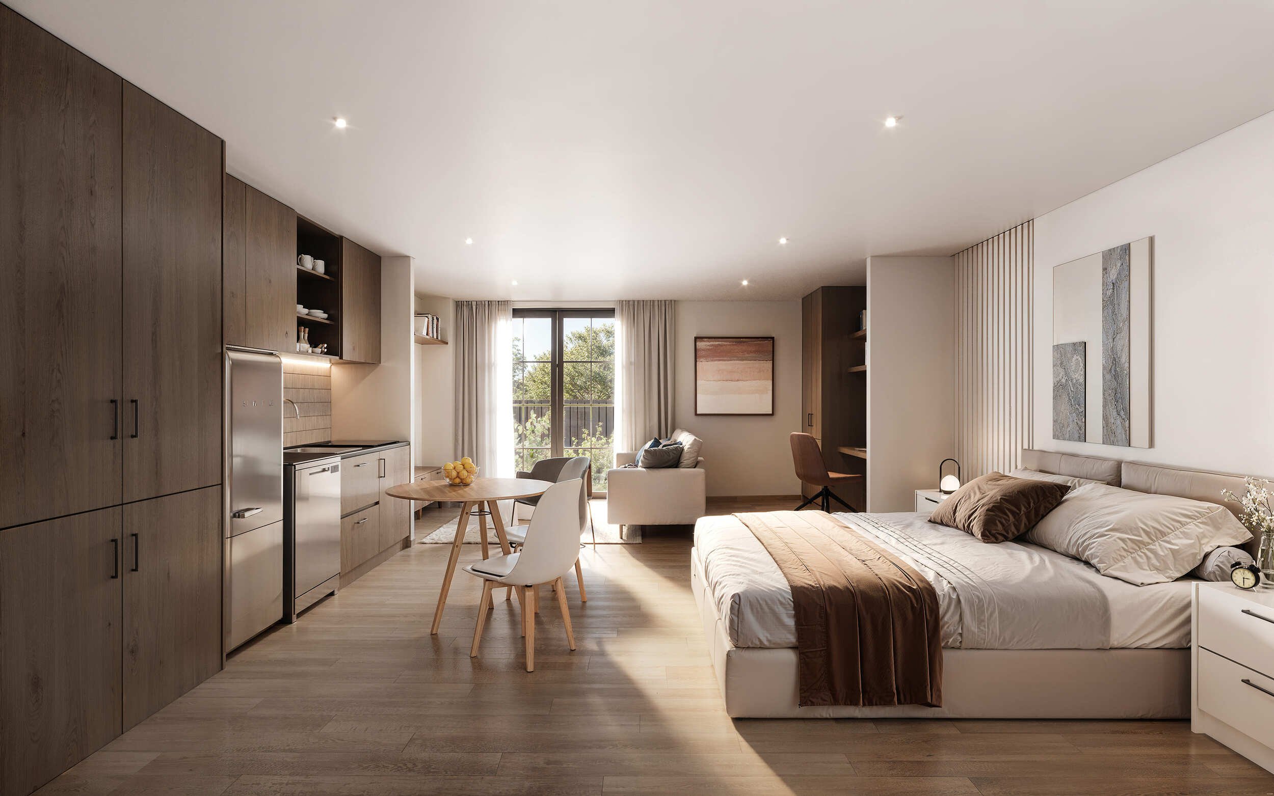 A modern, open-concept living space with a kitchen, dining area, and bedroom. Features include wooden cabinetry, a small dining table with chairs, a sofa, and a bed. Large windows with curtains let in natural light and show outdoor greenery.