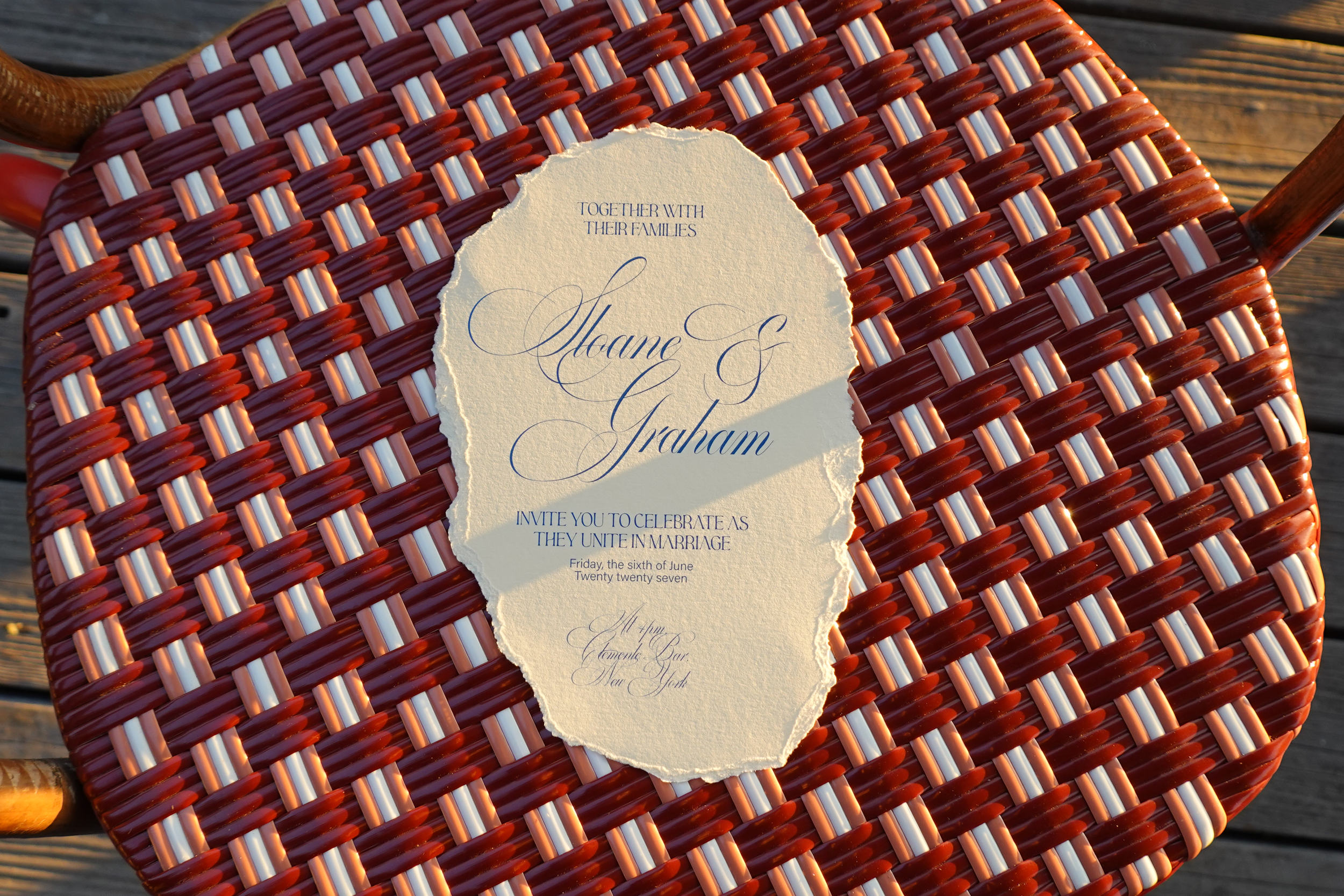 Wedding invite on terrace chair