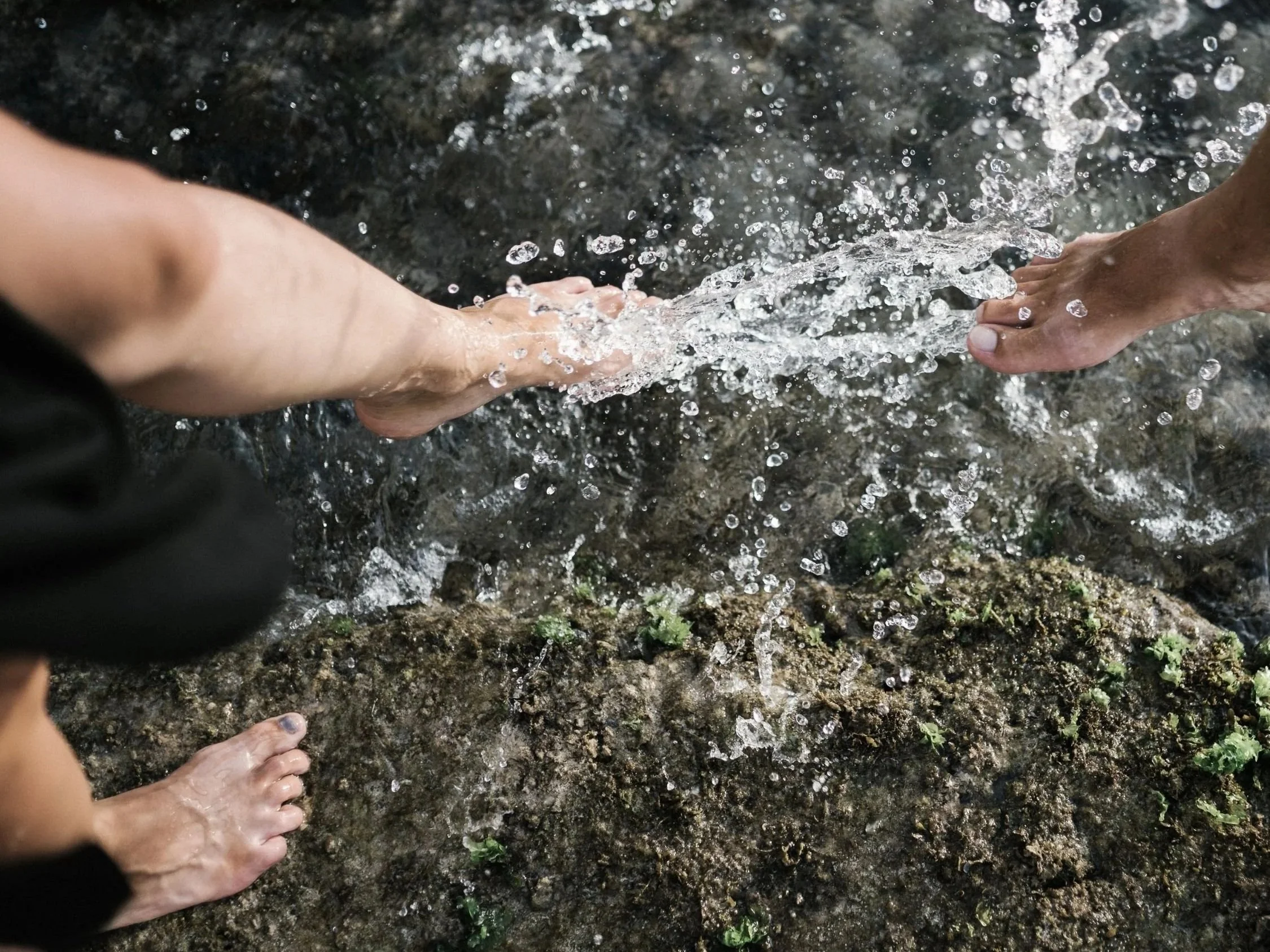 Feet splashing in water
