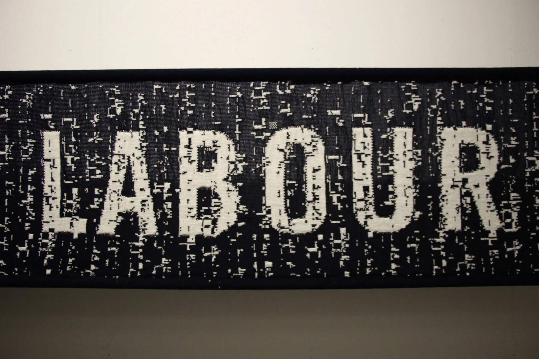 Punchcard Economy, Sam Meech, 2013. ODI: 3.5 x 0.5m knitted banner, FutureEverything: 5 x 3m knitted banner &amp; knitting machines.