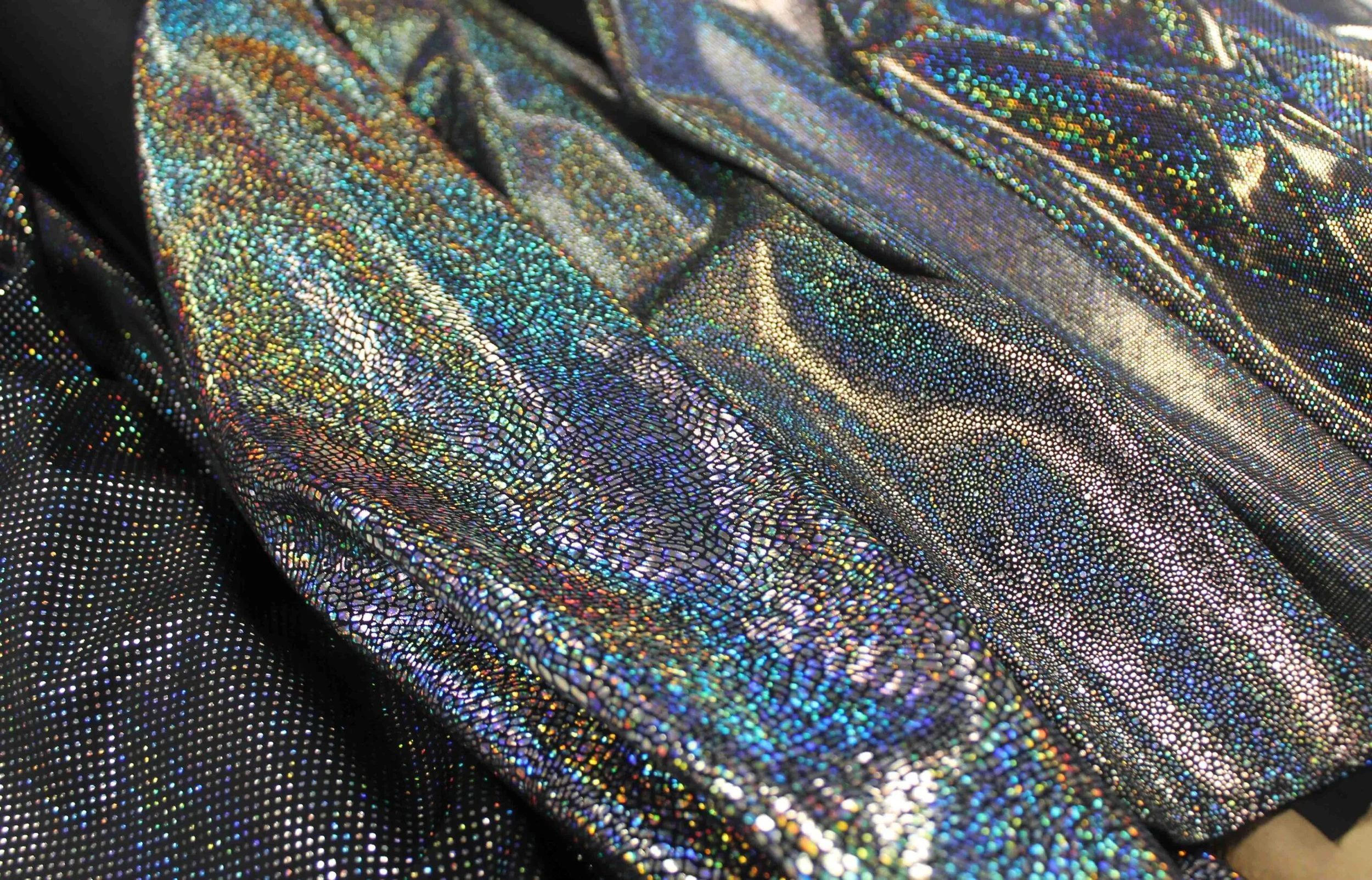 silver metallic fouls on black fabric