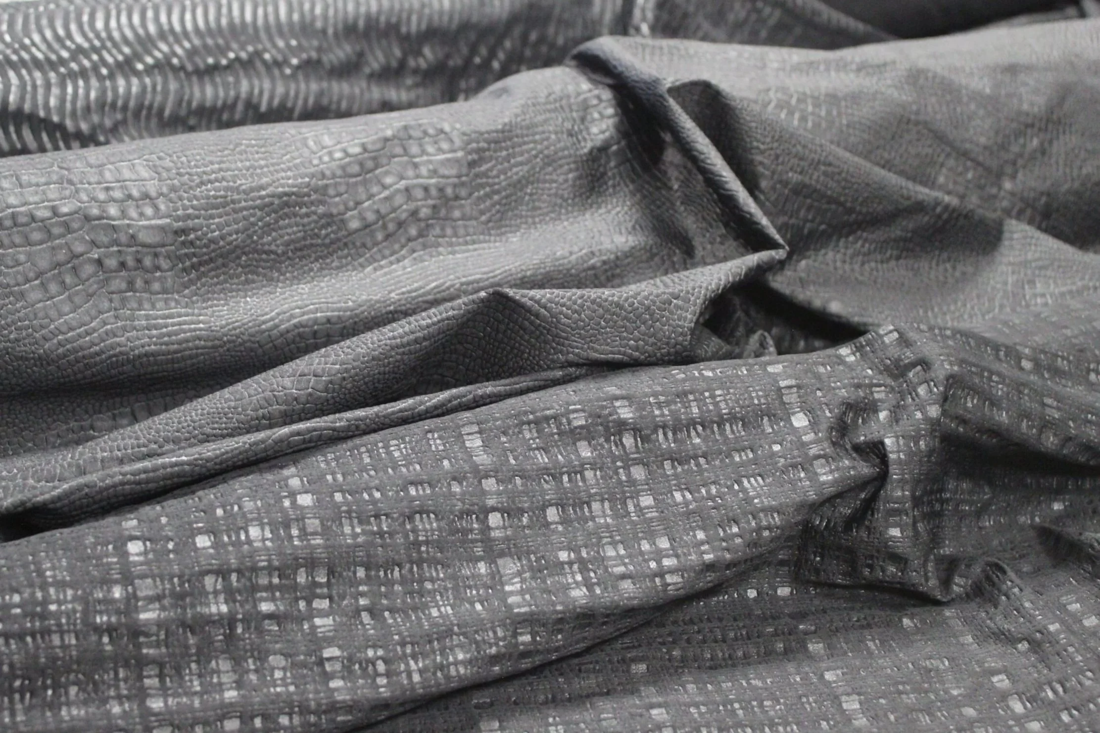 Embossed designs on black polyamide/elastane fabric, various patterns, for swimwear, lingerie and activewear