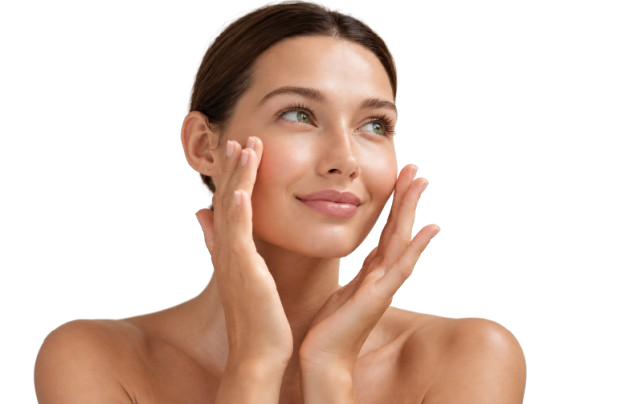 A young woman with clear skin touching her face with both hands, smiling softly, against a plain background.