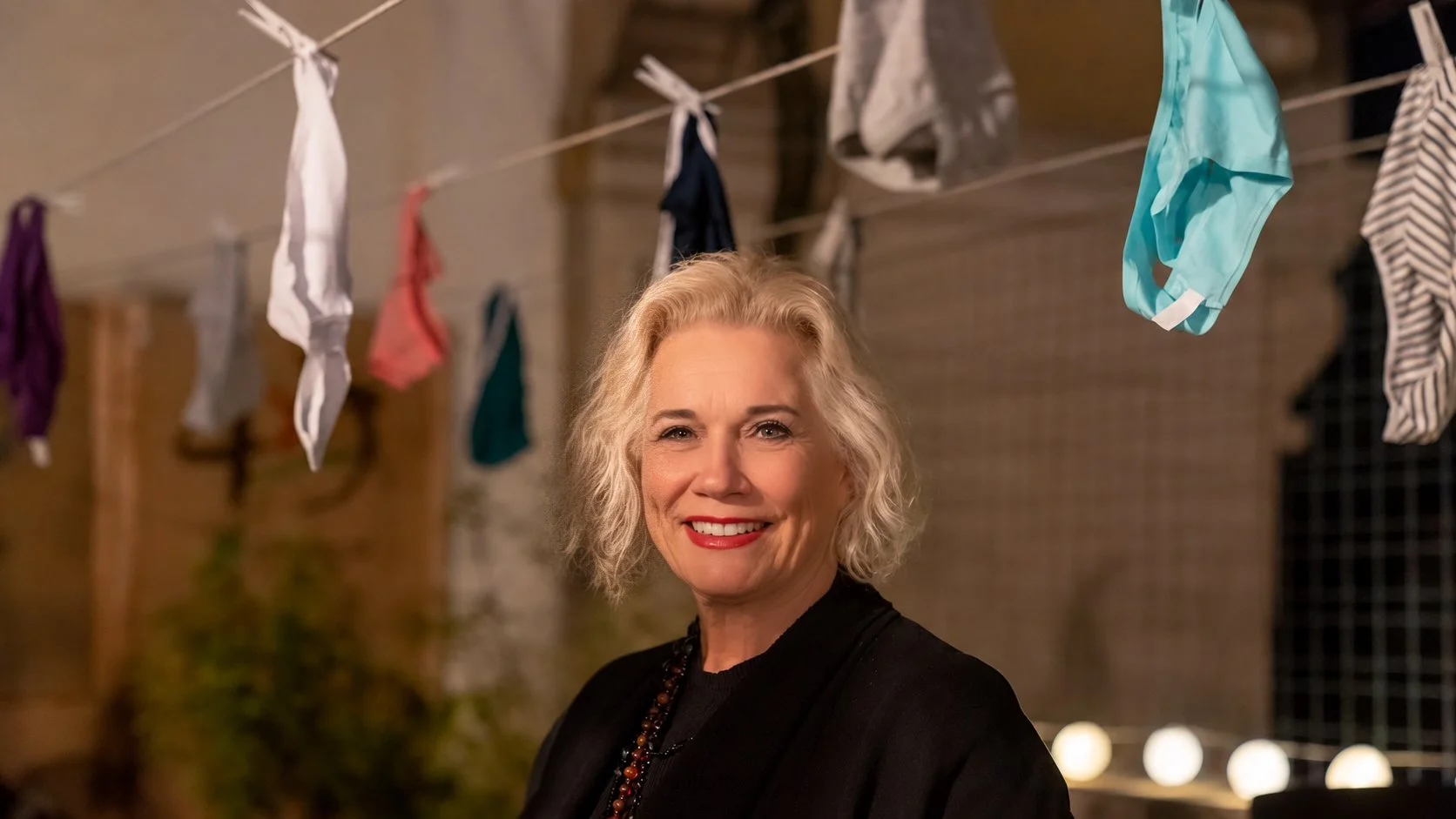 Myra Fiori in Venice, November 2022, at the debut of A Decorated Woman at D3082, with underwear hung on a clothesline behind her