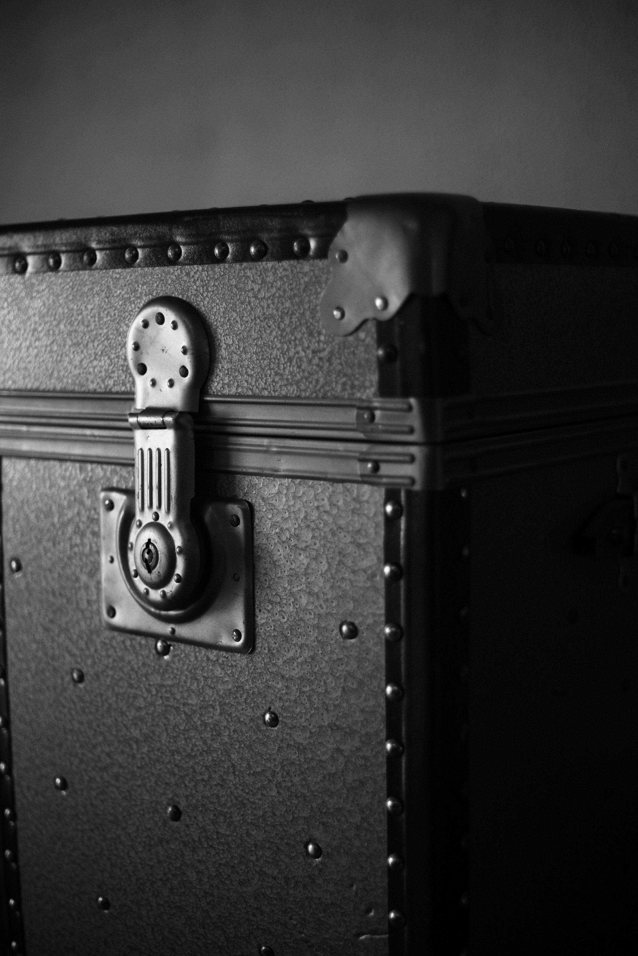 A black trunk with a lock on it