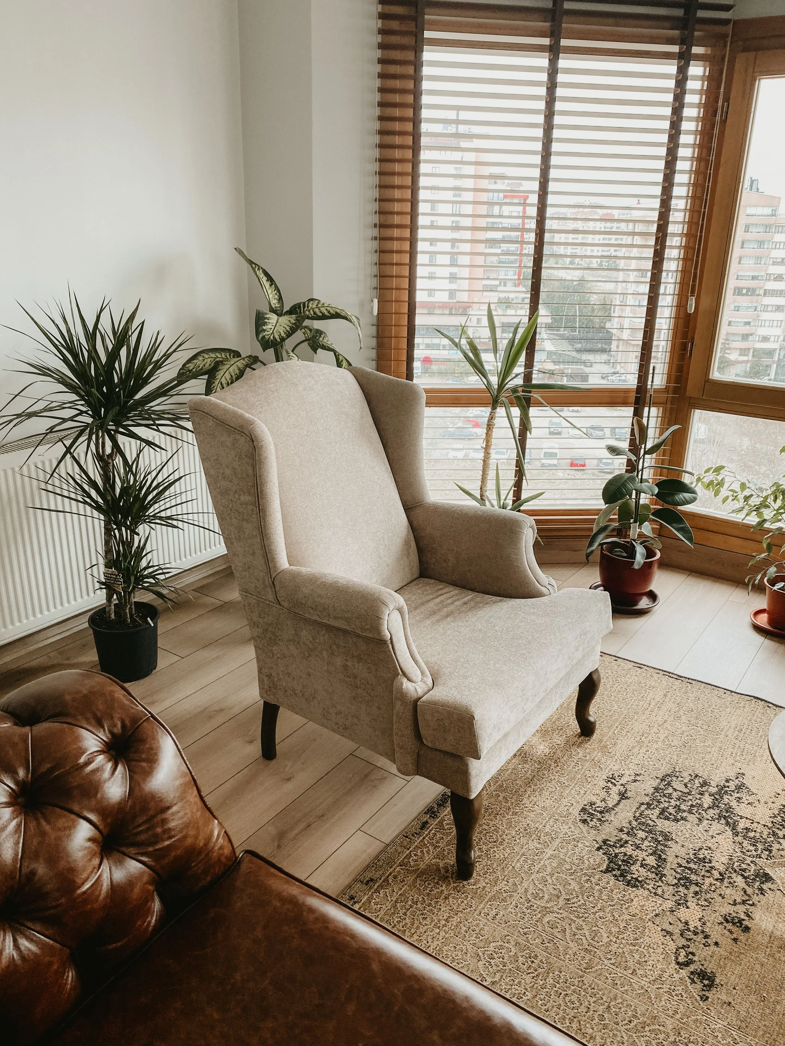 A tan wingback chair in a therapy office | Virtual EMDR therapy in Massachusetts
