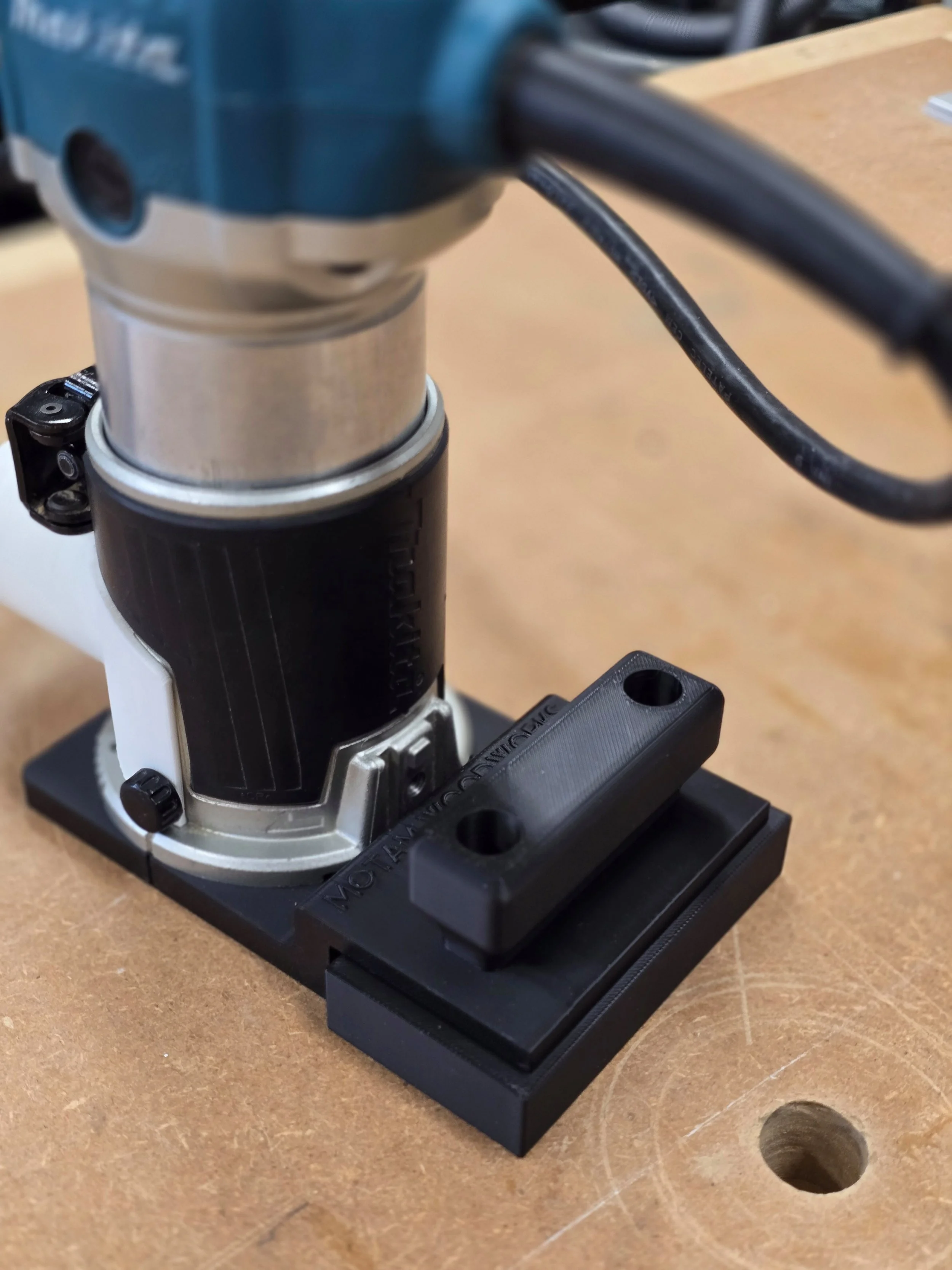 Makita compact router fitted with the Motam Woodworks base and handle