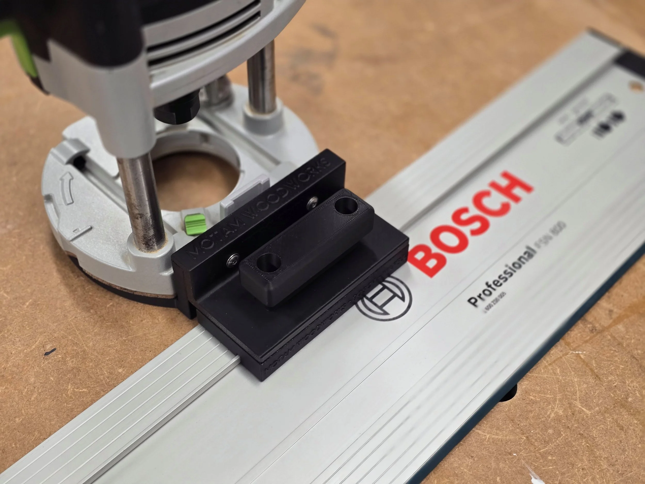 Router fitted with the Motam Woodworks base and handle, resting on a Bosch Professional guide rail