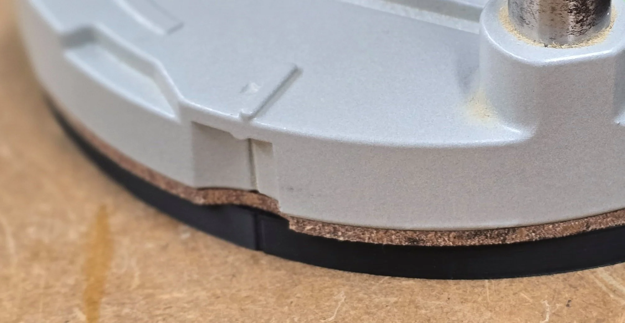 Macro detail of the router's factory base ring edge