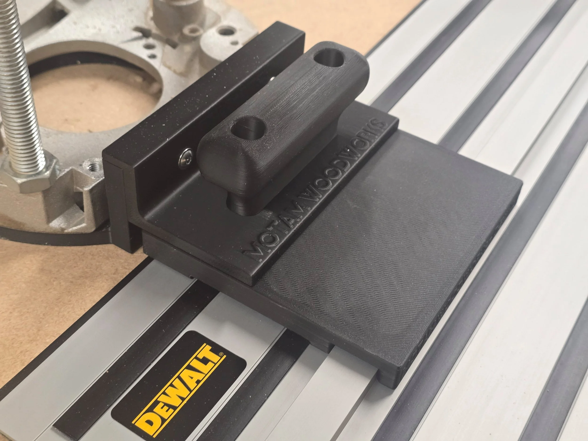 Motam Woodworks router base and handle fitted to a Dewalt DW625 router, mounted on a Dewalt guide rail