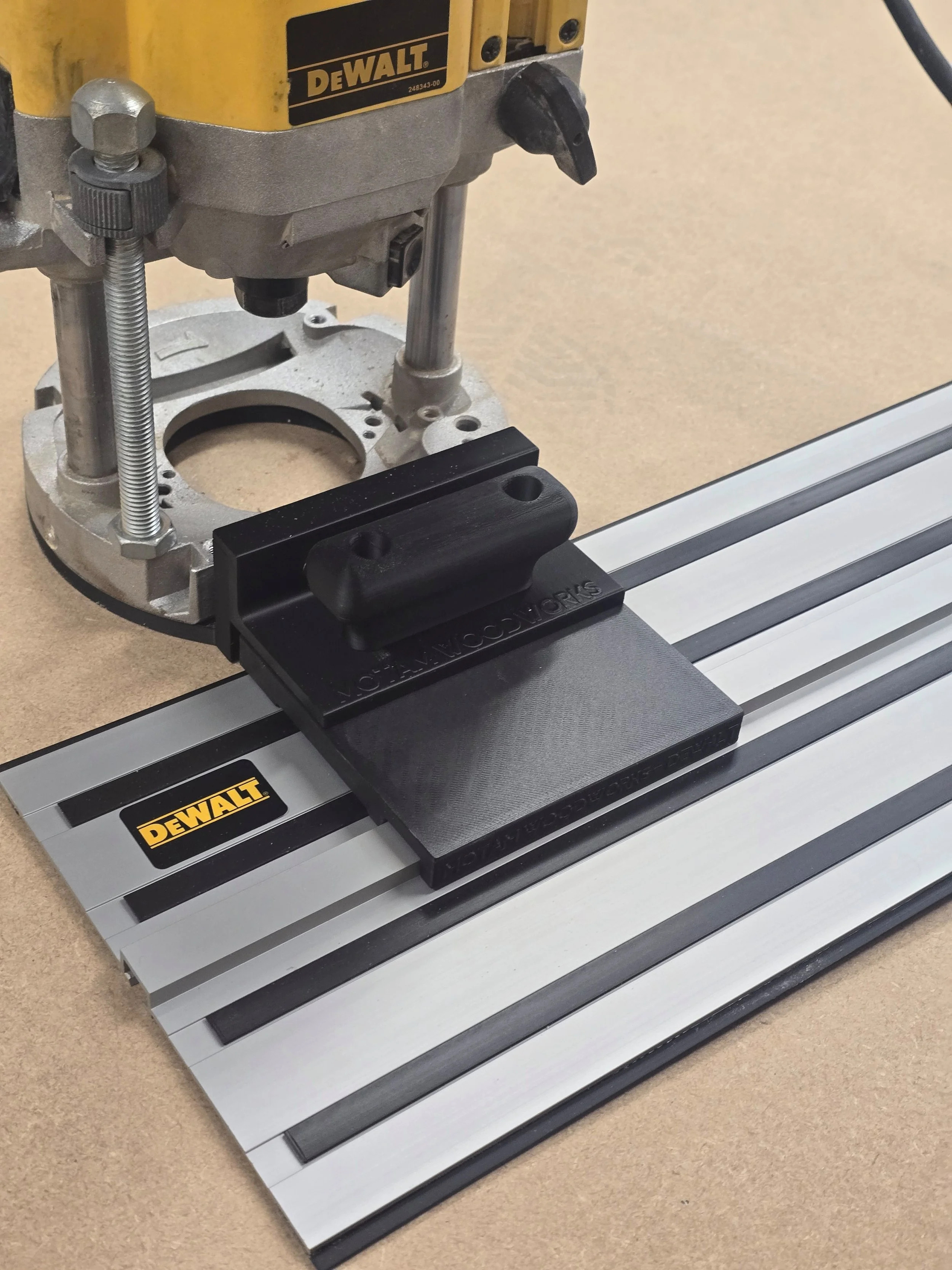 Dewalt DW625 router with the Motam Woodworks base and handle attached, resting on a Dewalt guide rail
