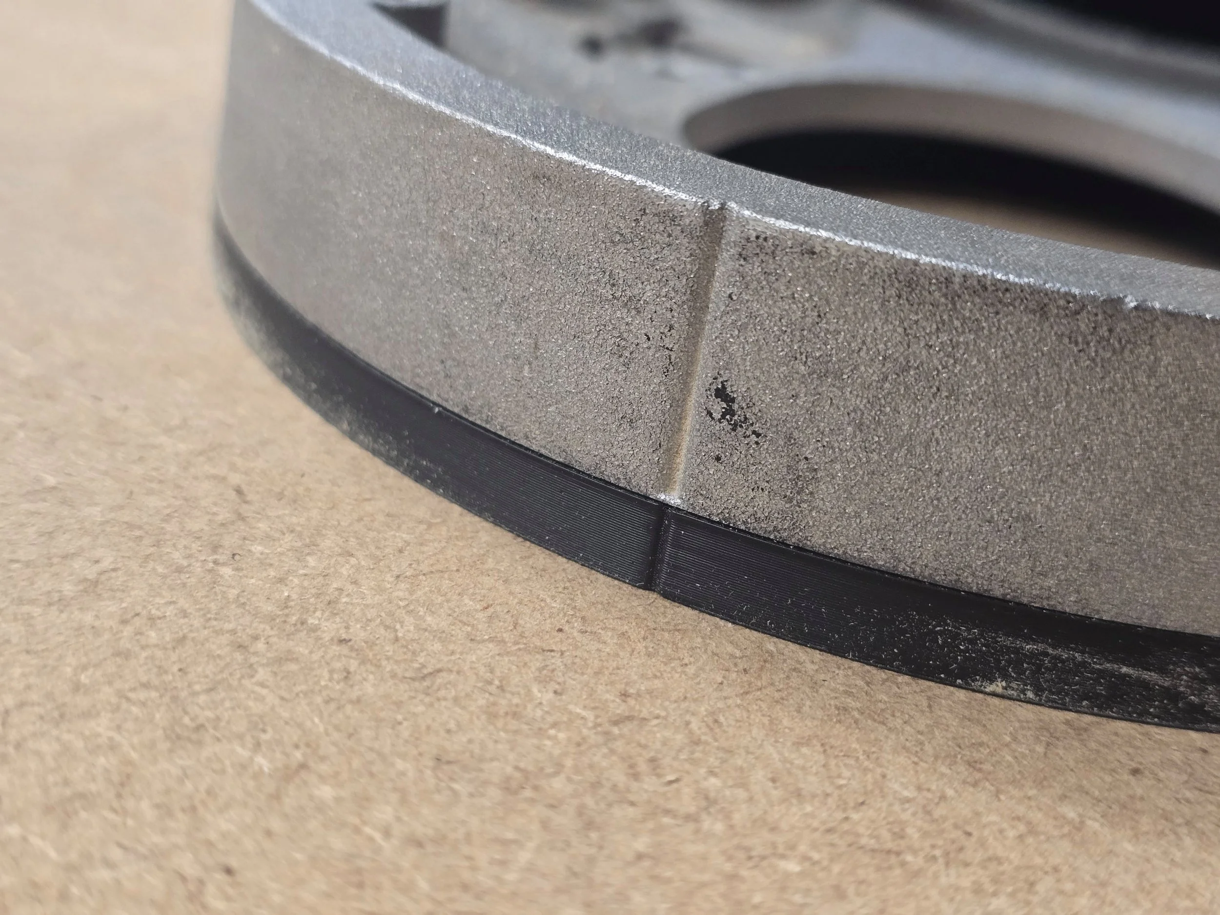 Close-up of the Dewalt DW625 router's factory base ring