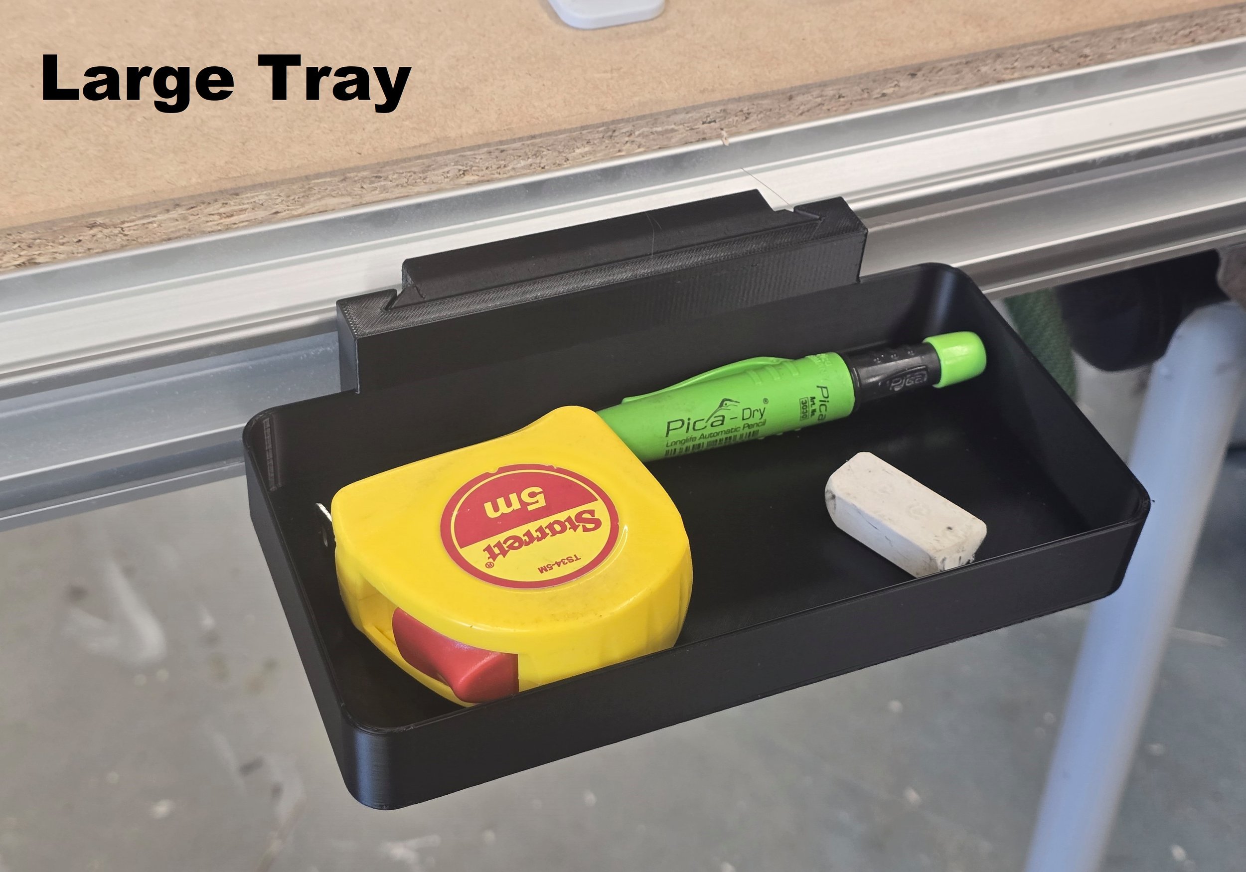 The Large Tray mount holding a tape measure, pencil, and eraser