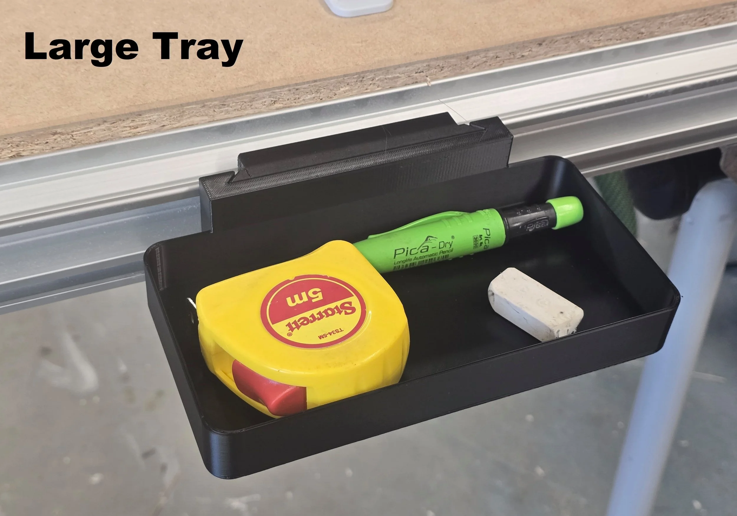 The Large Tray mount holding a tape measure, pencil, and eraser