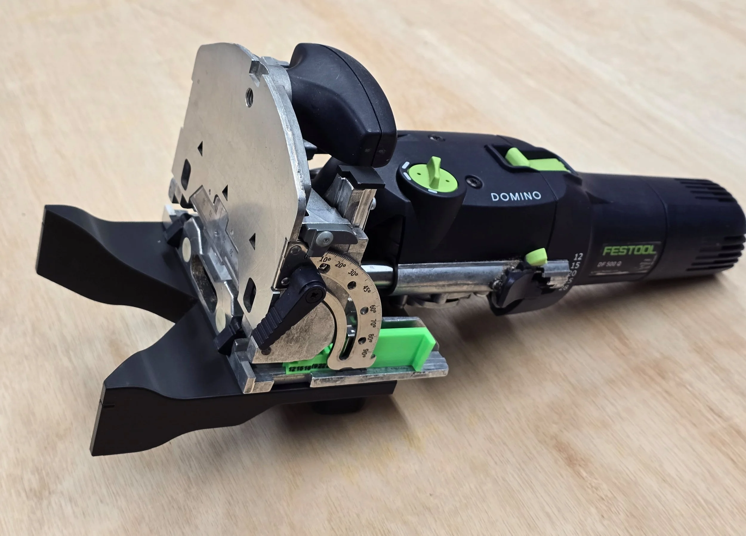 The spline jig fitted to a Festool Domino DF 500, with the depth stop gauge mounted alongside