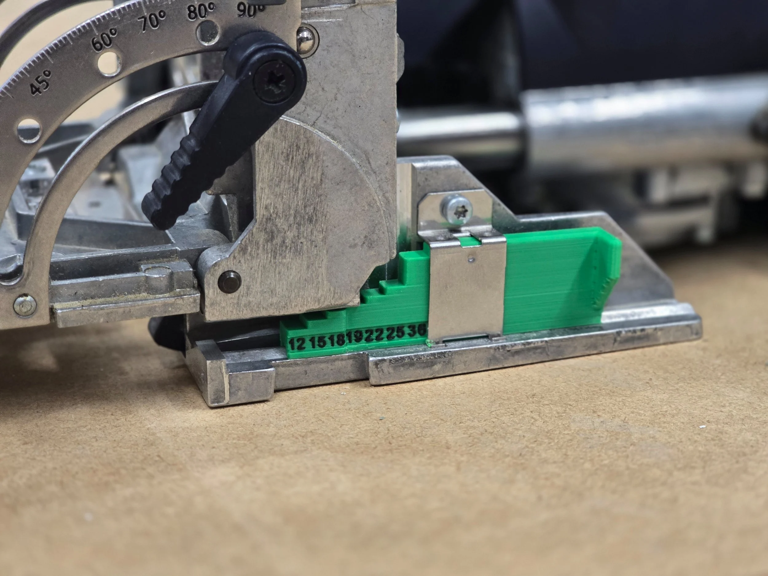 Wider view of the depth gauge fitted to the Domino DF500, showing the angle scale and depth stop lever