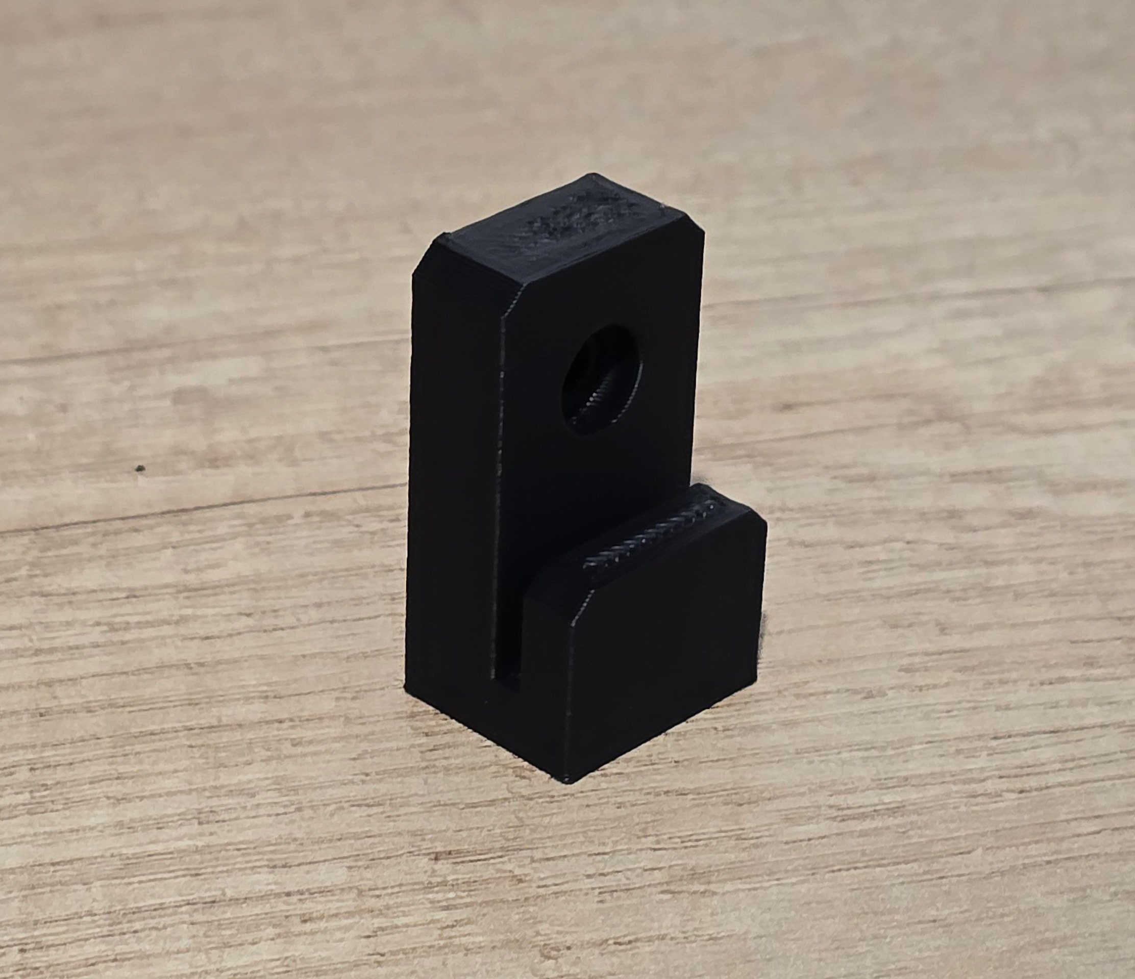 Angled view of a single unmounted wall mount bracket