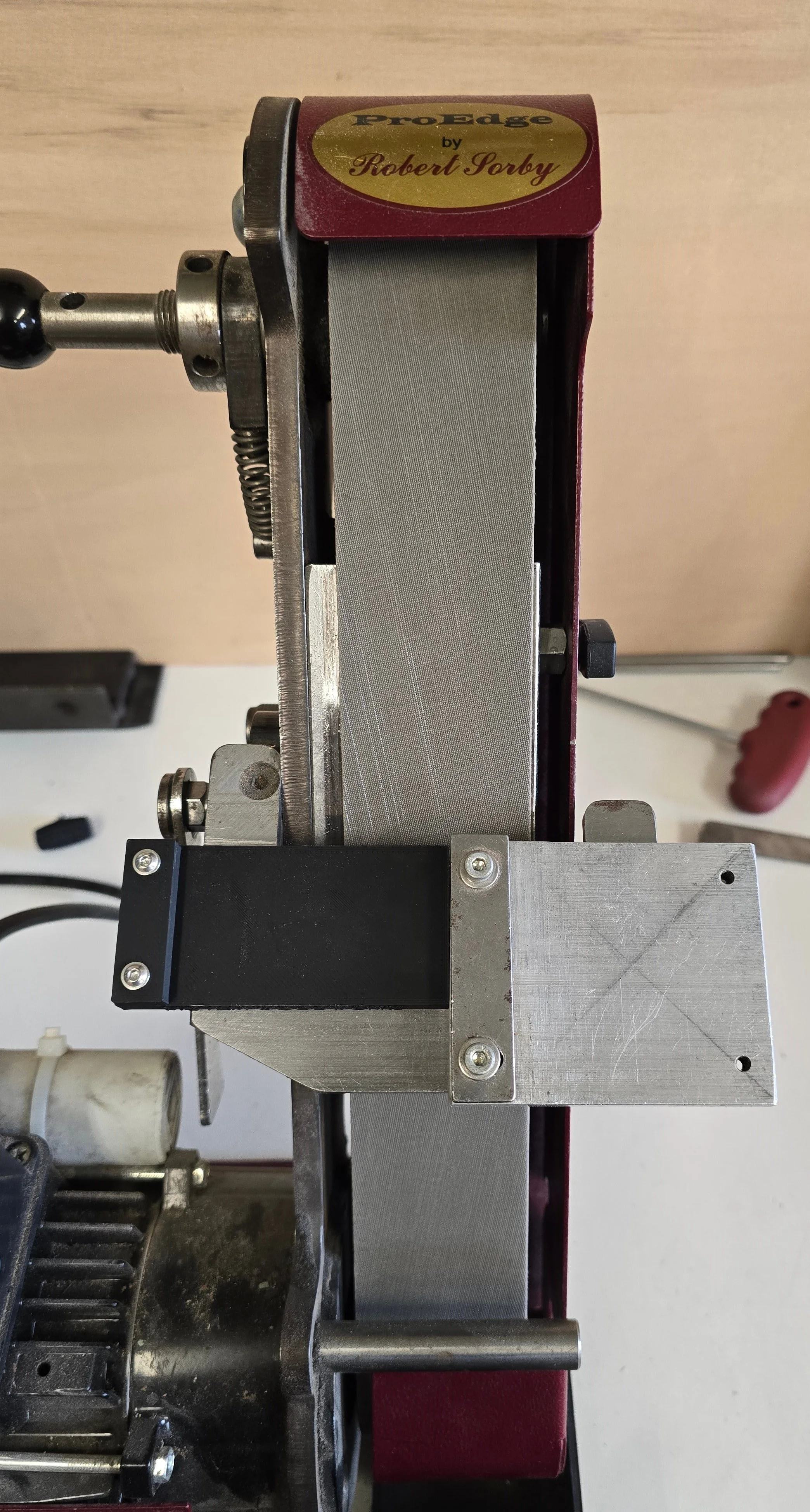 The Motam Woodworks square guide jig mounted on the ProEdge machine with the aluminium PESQW model for comparison