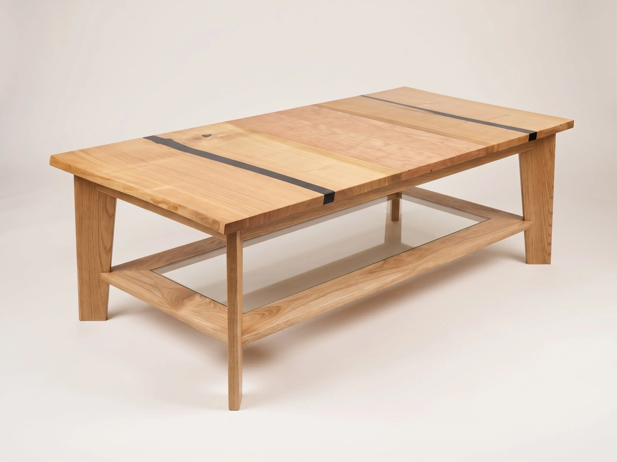 A wooden coffee table with a glass shelf underneath and black metal accents on the tabletop.