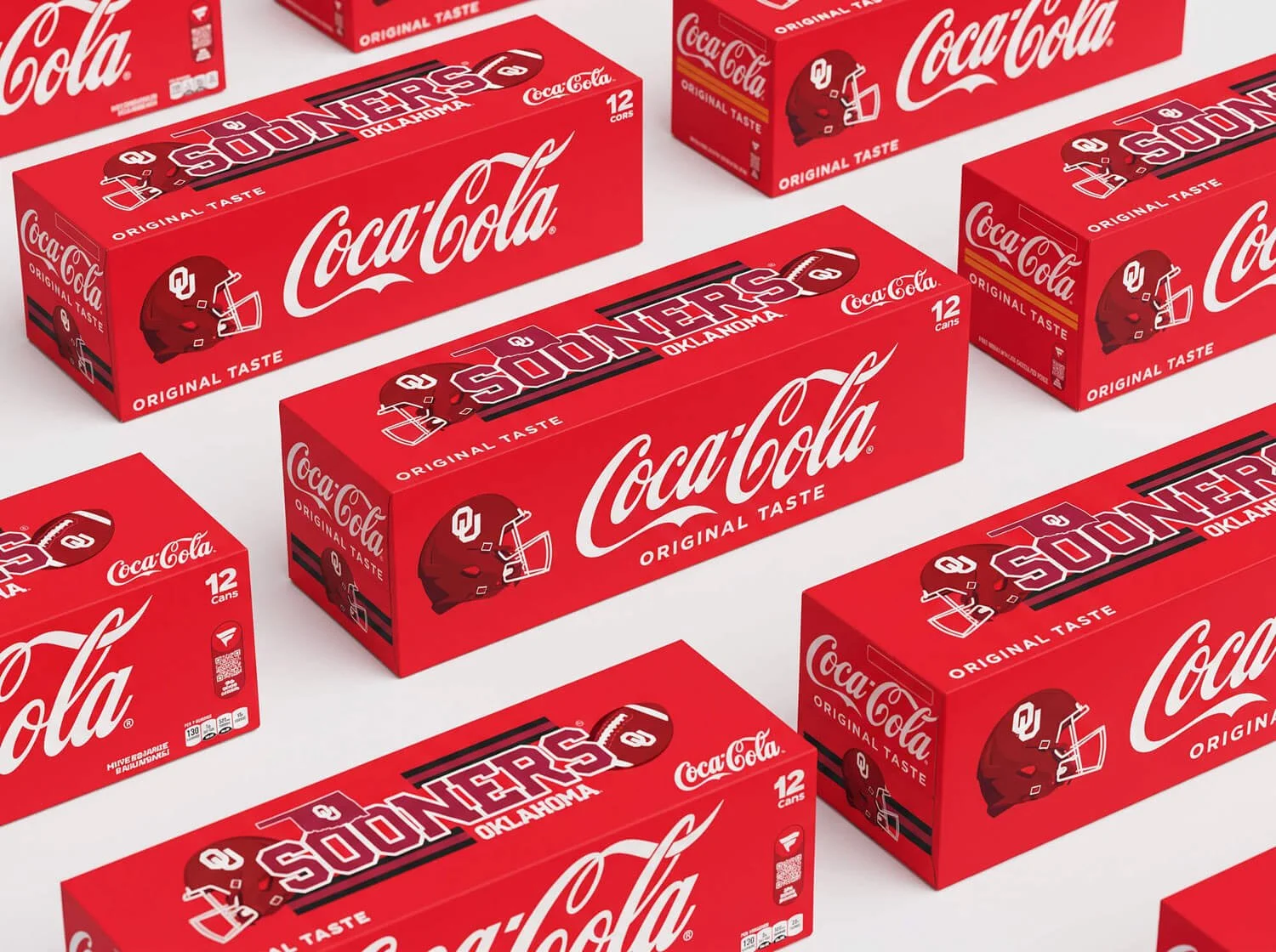 Multiple boxes of Coca-Cola soda cans featuring Oklahoma Sooners branding.