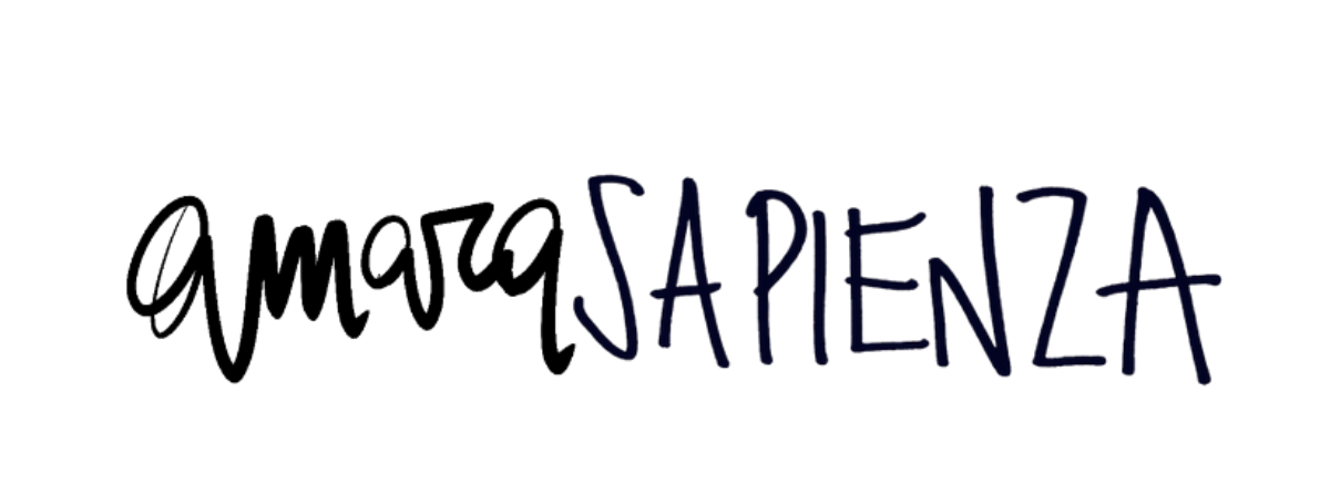 Close-up of handwritten text the words 'Amara Sapienza' written in black and blue marker.