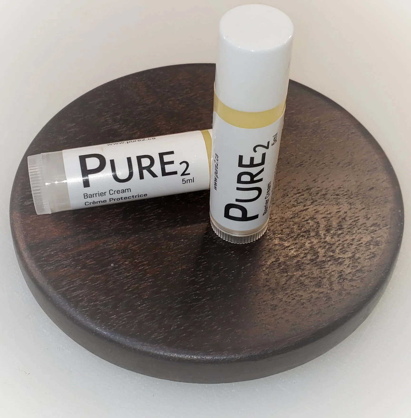 Pure2 Lip Guard is a modified version of our Pure2 Barrier Cream specially formulated for your lips. Pure2 Lip Guard consists of only two ingredients: mineral oil and beeswax. The unique formula allows for easy absorption while maintaining a protecti