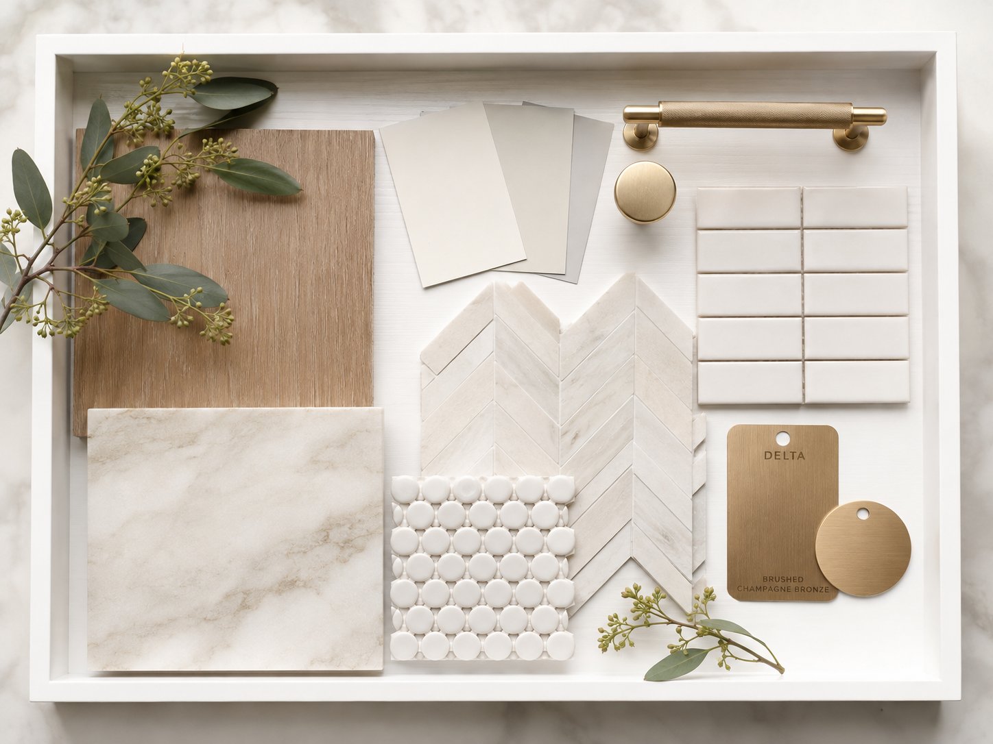 Interior design mood board with wood, stone, tile, paint colors, brass hardware, and decorative finish samples.