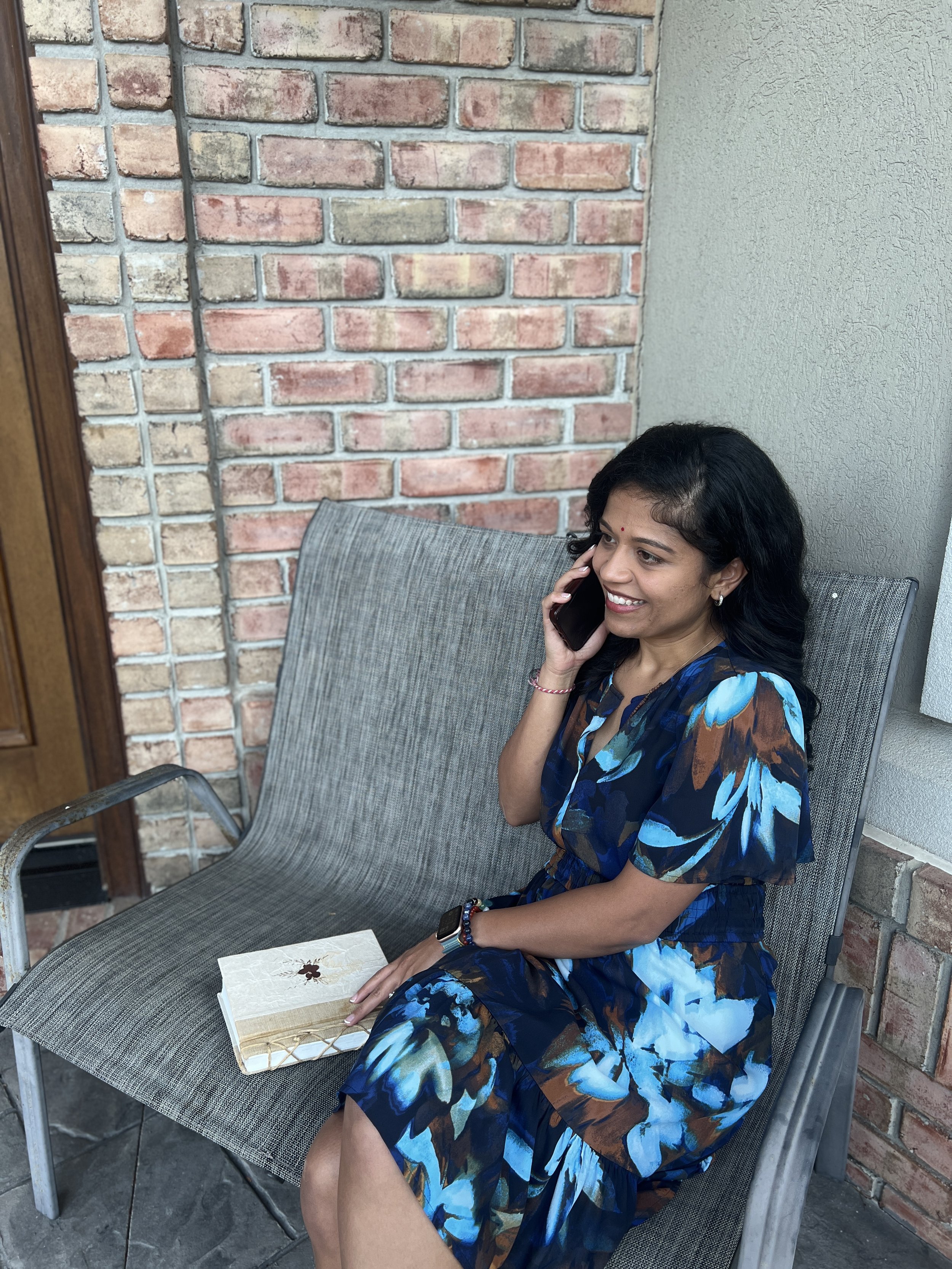 Nishi Jani Rajguru appears to be talking on the phone.