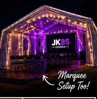 JK85 marquee set up at night with festoon lighting