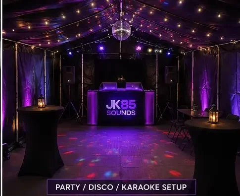 JK85 marquee set up for a party with a DJ booth, dance floor and lounge tables