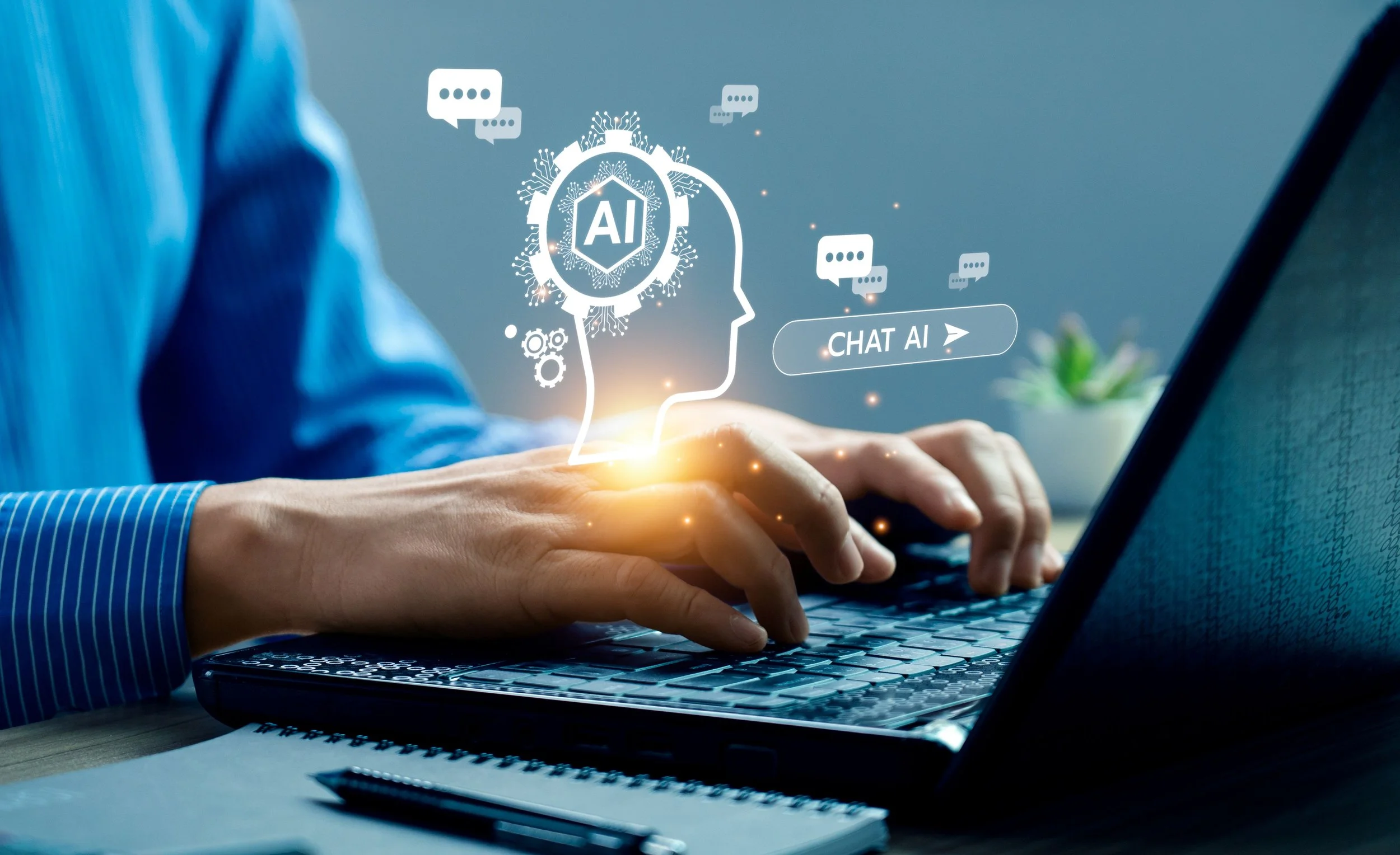 Person typing to a Chat AI on a laptop