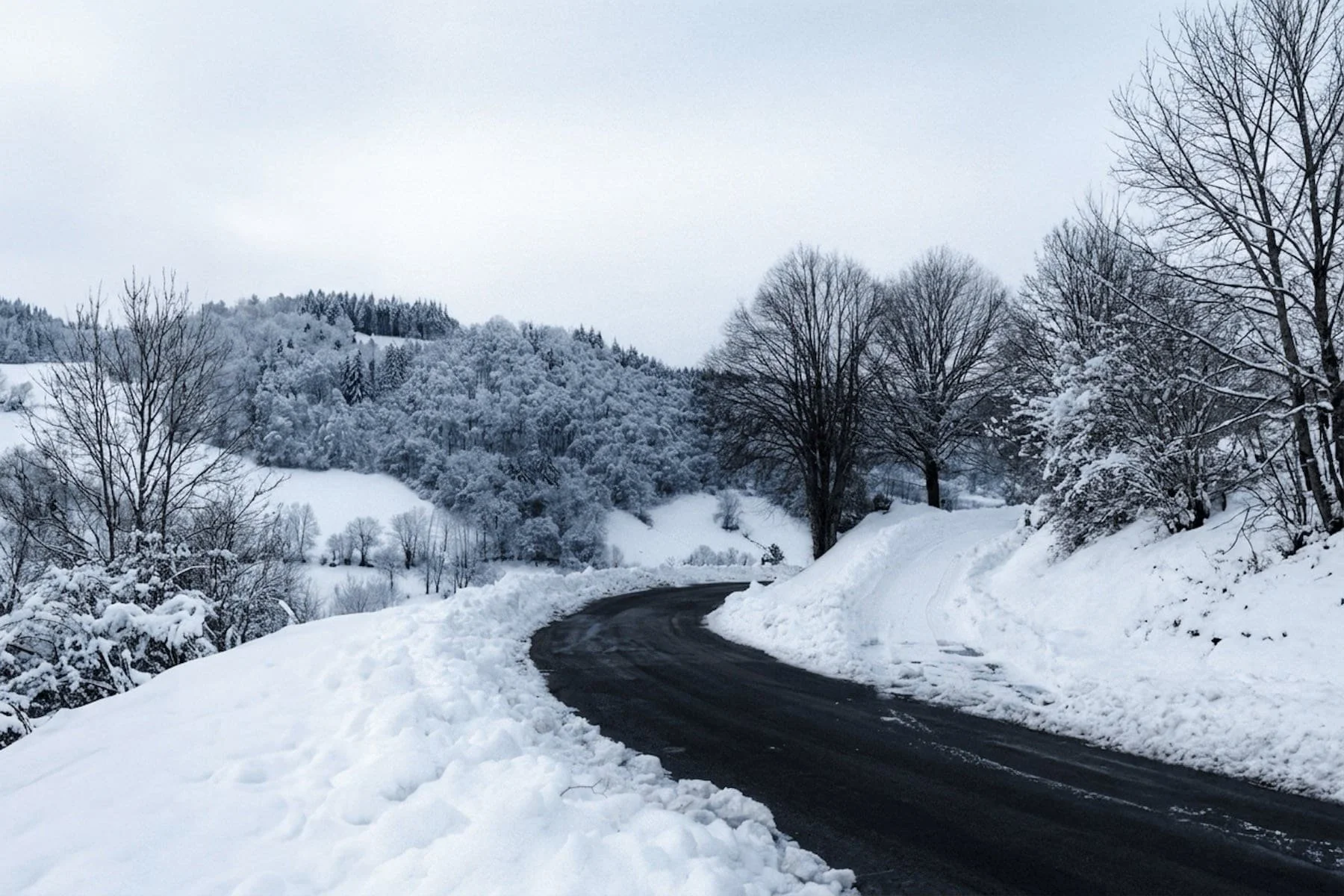 Snow removal service clearing a residential driveway in Clifton Park, NY