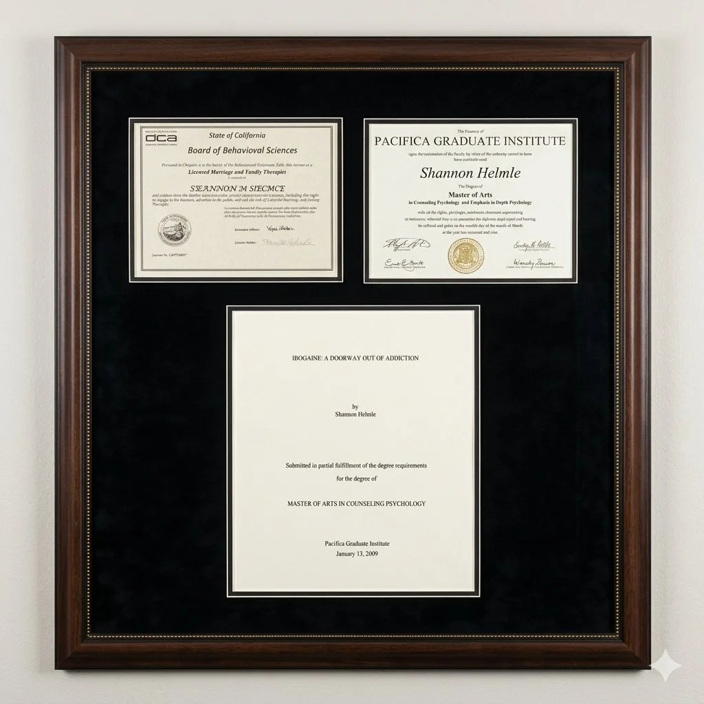A framed display of three academic certificates on a wall. The top left certificate is from the State of California Board of Behavioral Sciences, awarded to Shannon M. Siecmce. The top right certificate is from Pacifica Graduate Institute awarded to Shannon Helme for a Master of Arts in Counseling Psychology. The bottom certificate is also from Pacifica Graduate Institute, awarded to Shannon Helme for a Master of Arts in Counseling Psychology, dated January 13, 2009.