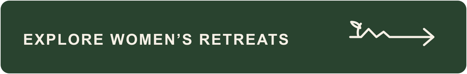 Green button with white text that says 'Explore Women's Retreats' and a simple line drawing of a plant and arrow.