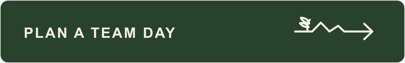Green button with white text that says 'Plan a Team Day' and an arrow pointing to the right.