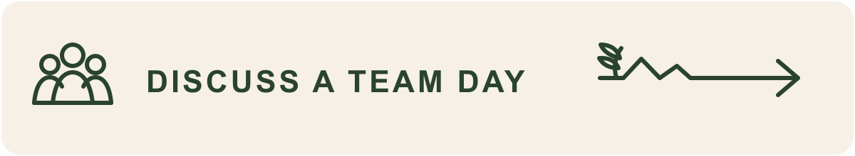 Badge with icon of three people and the text "Discuss a Team Day" and an arrow with a leaf icon.