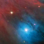 Colorful image of a nebula with bright stars and cosmic dust in deep space.