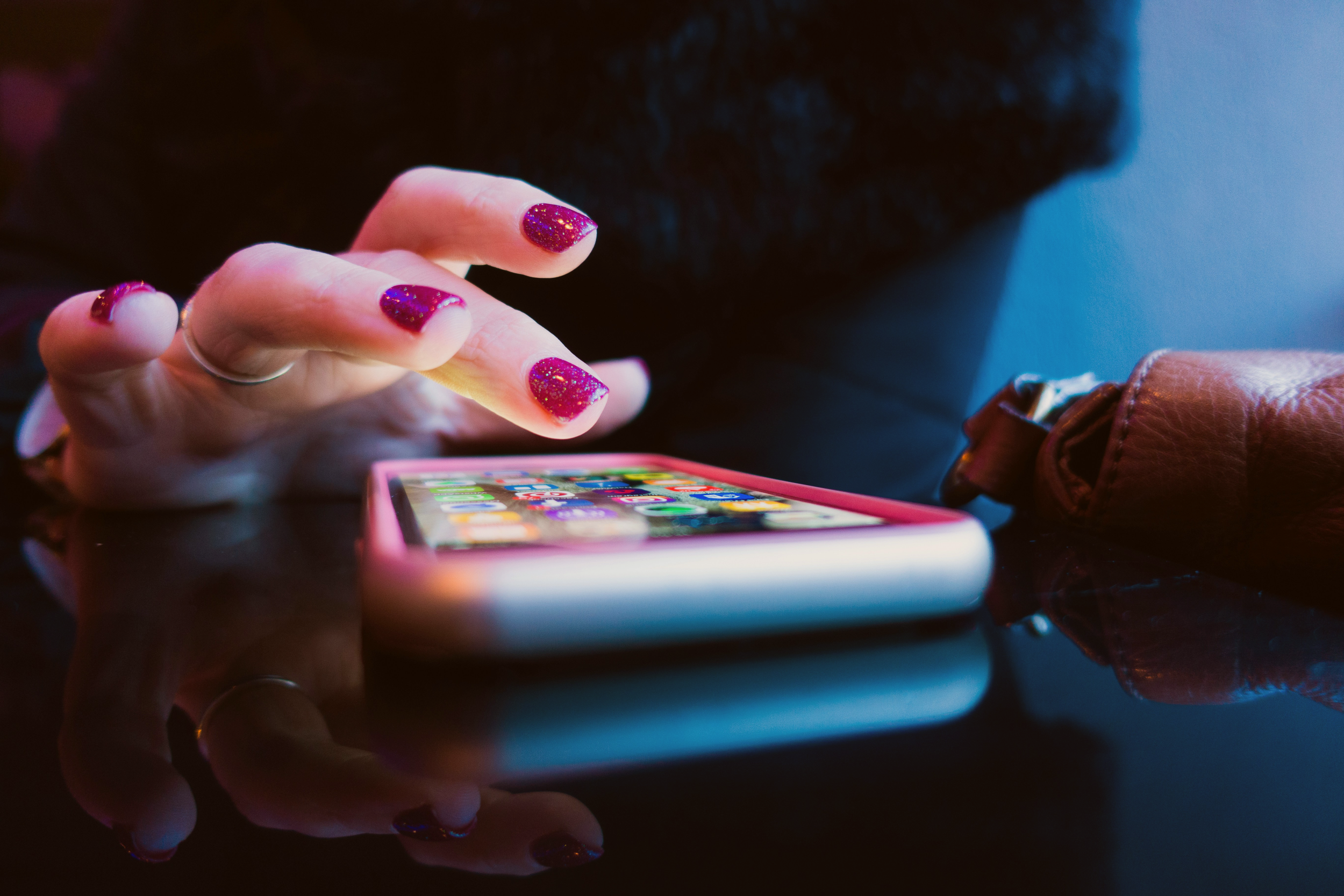 Close-up on a user's hands, using a phone. The goal of the Delivery stage is to get real tech in the hands of your users.
