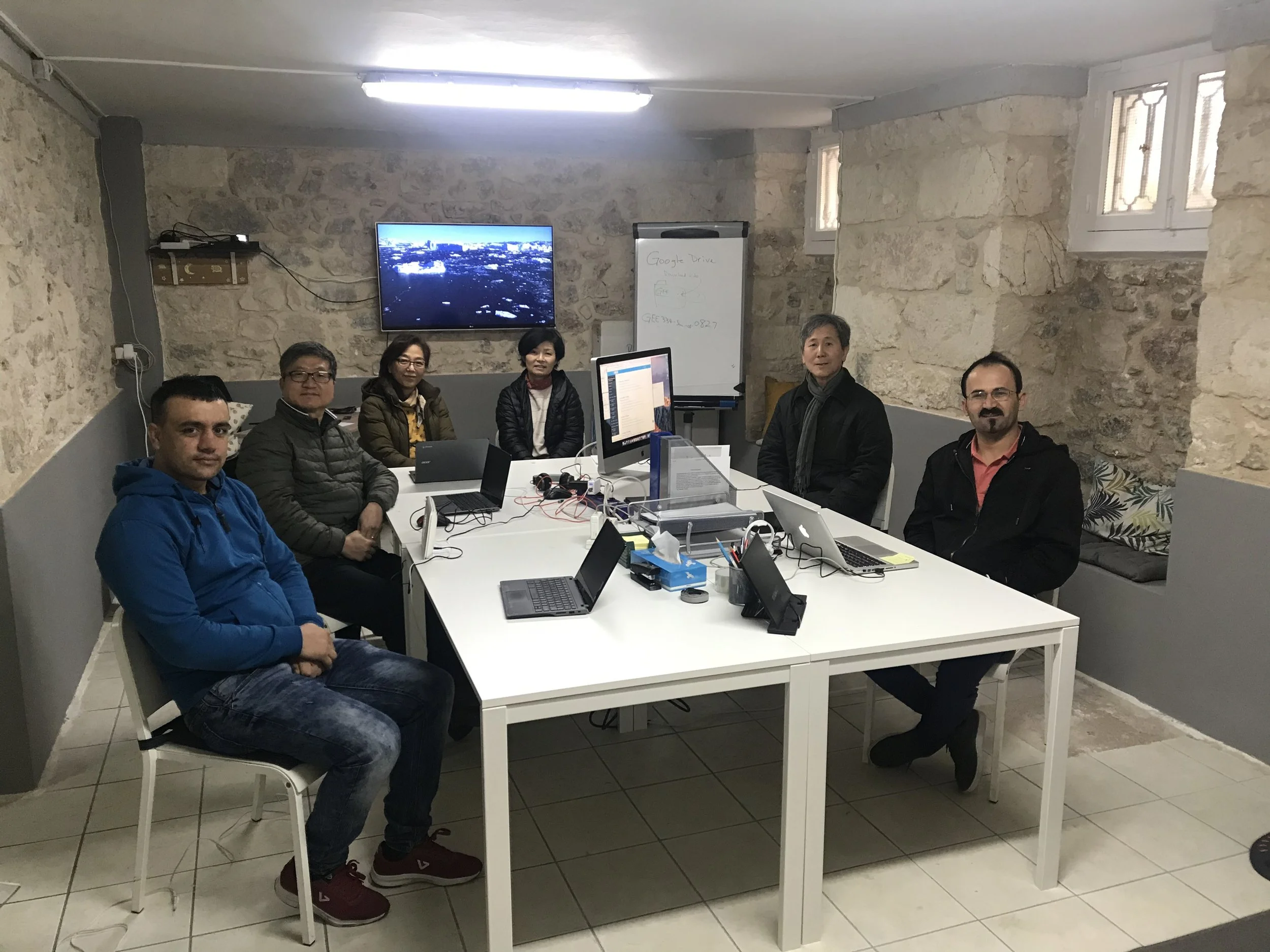 Fred and Kelly Shin with ministry partners in the first Koinonia Education Center basement space in Exarcheia, Athens, in January 2020