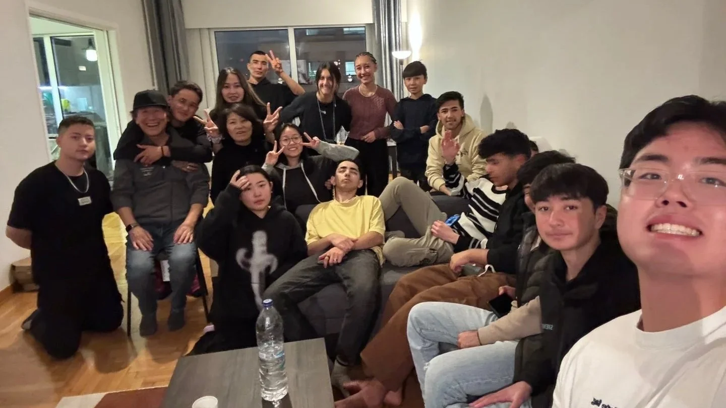 Refugee young adults and ministry volunteers gathered together in a home in Athens.