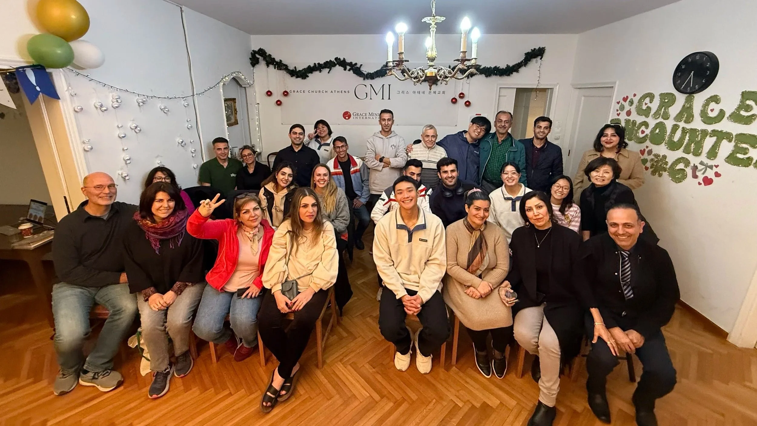 Refugee young adults and ministry volunteers gathered at Athens Grace Church in Greece.