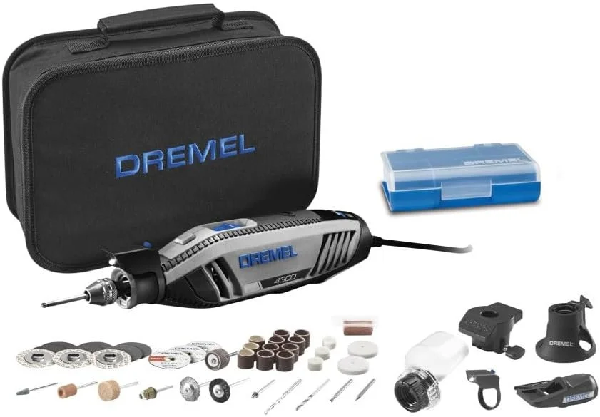 Set of Dremel rotary tool accessories, toolkit, and carrying case.