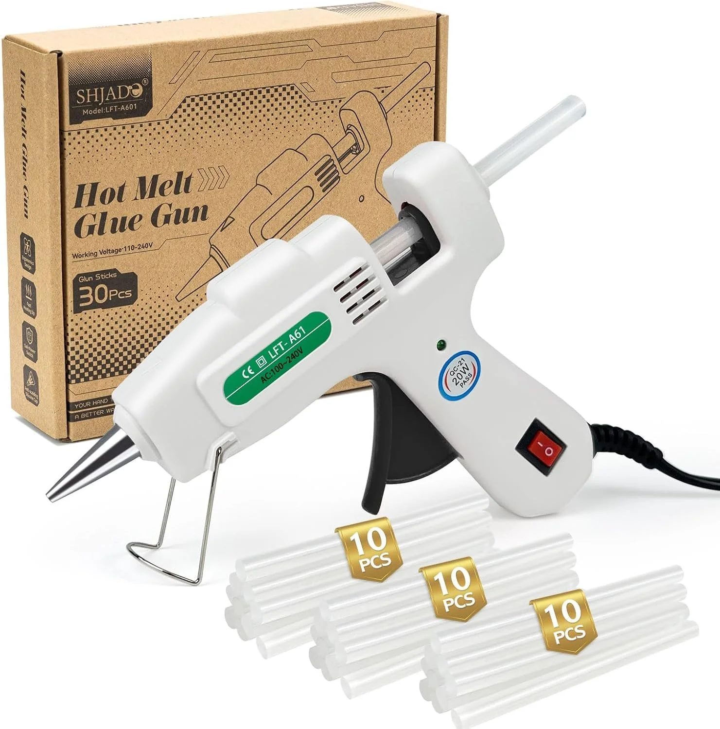 A hot melt glue gun with a box of 30 glue sticks and three packs of 10 glue sticks each. The glue gun is white with a black trigger, labeled with voltage specifications, and is plugged in.