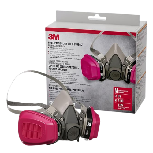 Pink 3M reusable respirator mask next to its packaging box.